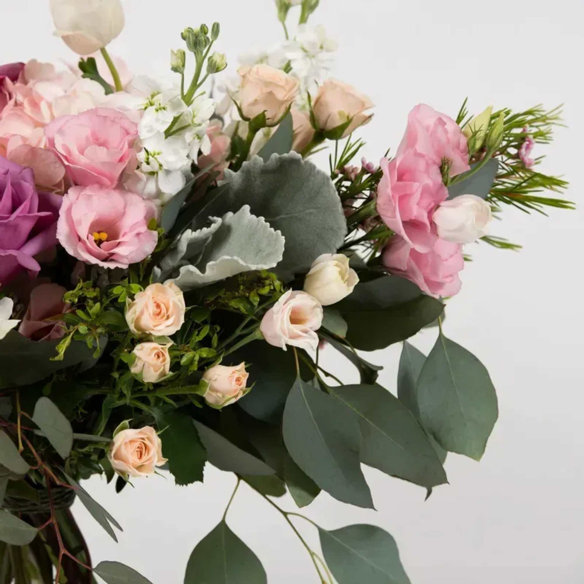 Cool off with this lovely bouquet of roses and hydrangeas.
