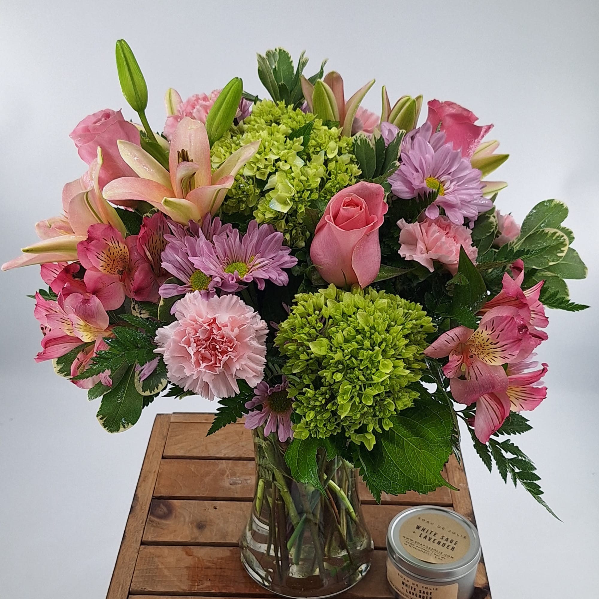 Introducing our Beautiful Butterfly flower arrangement, a charming display of pink lilies