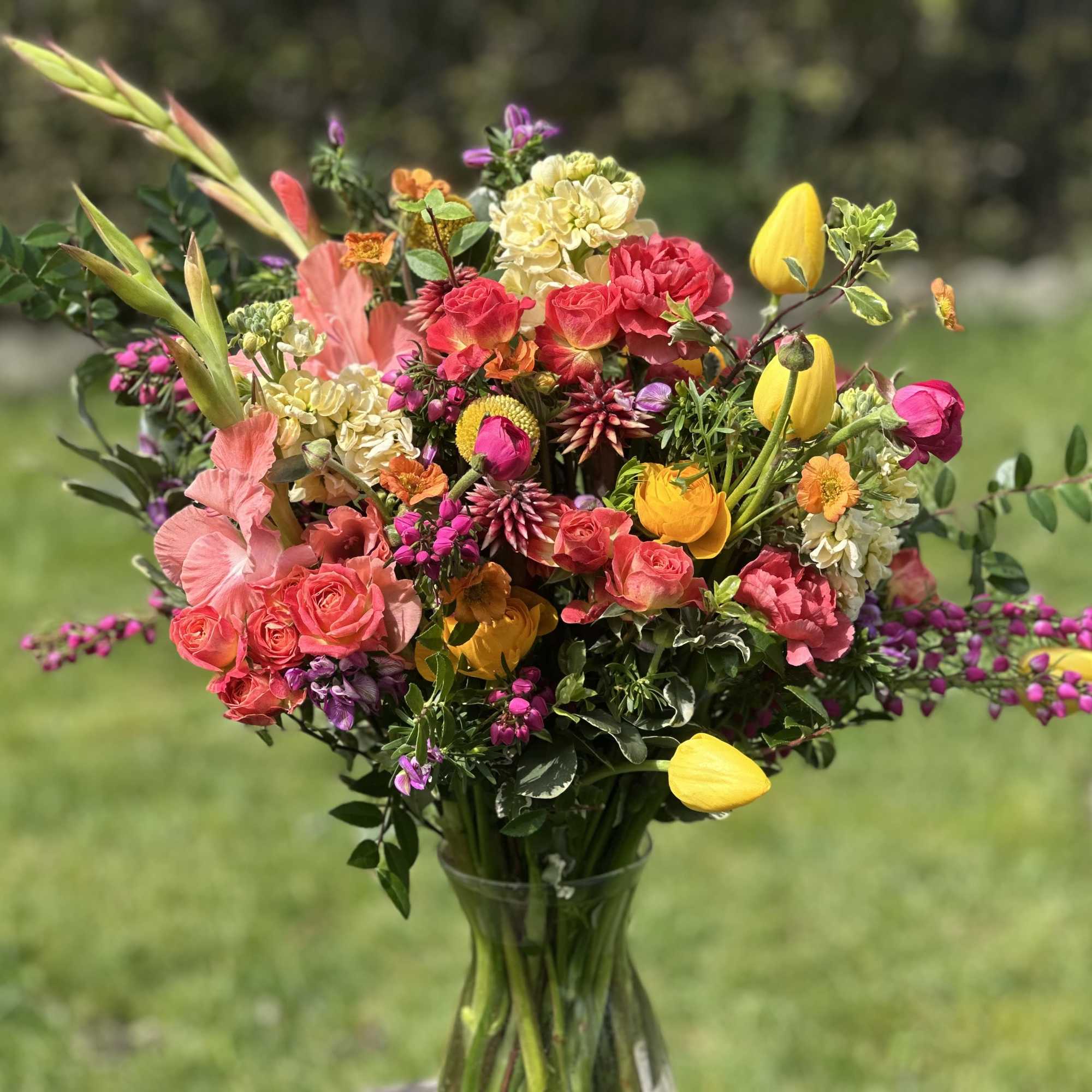 Colorful mixed bouquet in a clear glass vase