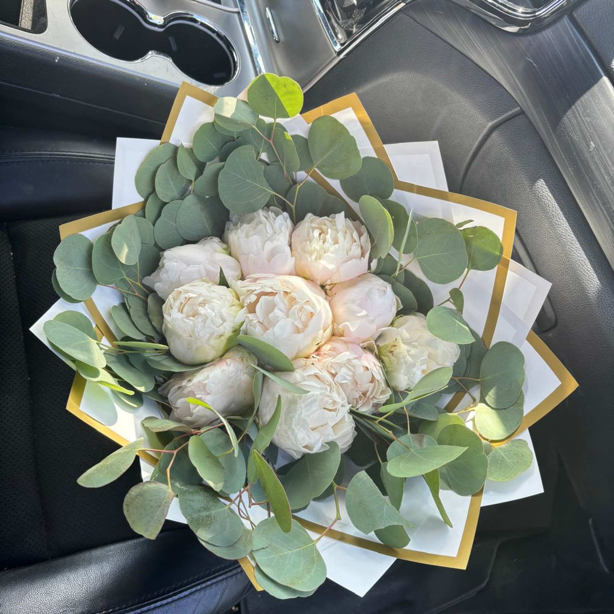 White peony bouquet with eucalyptus in white and gold wrap