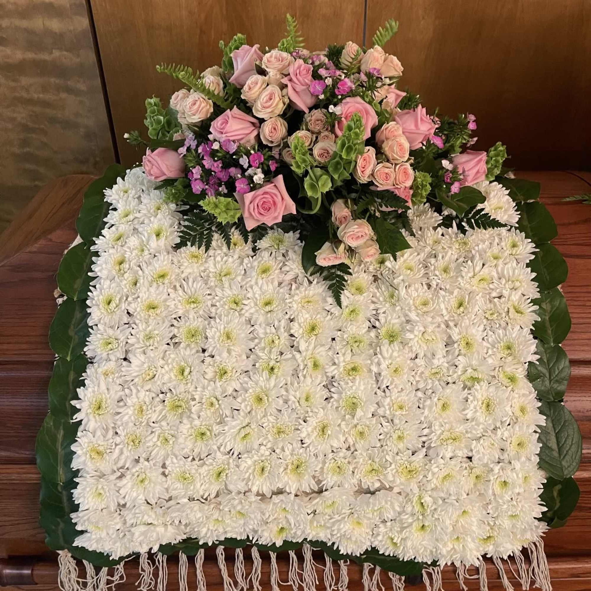 White chrysanthemum blanket with pink roses and small purple flowers