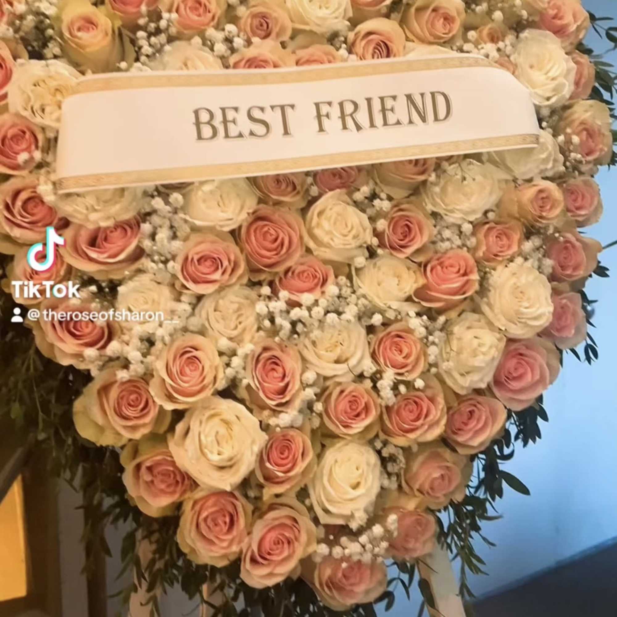 Heart-shaped rose arrangement with a "BEST FRIEND" ribbon