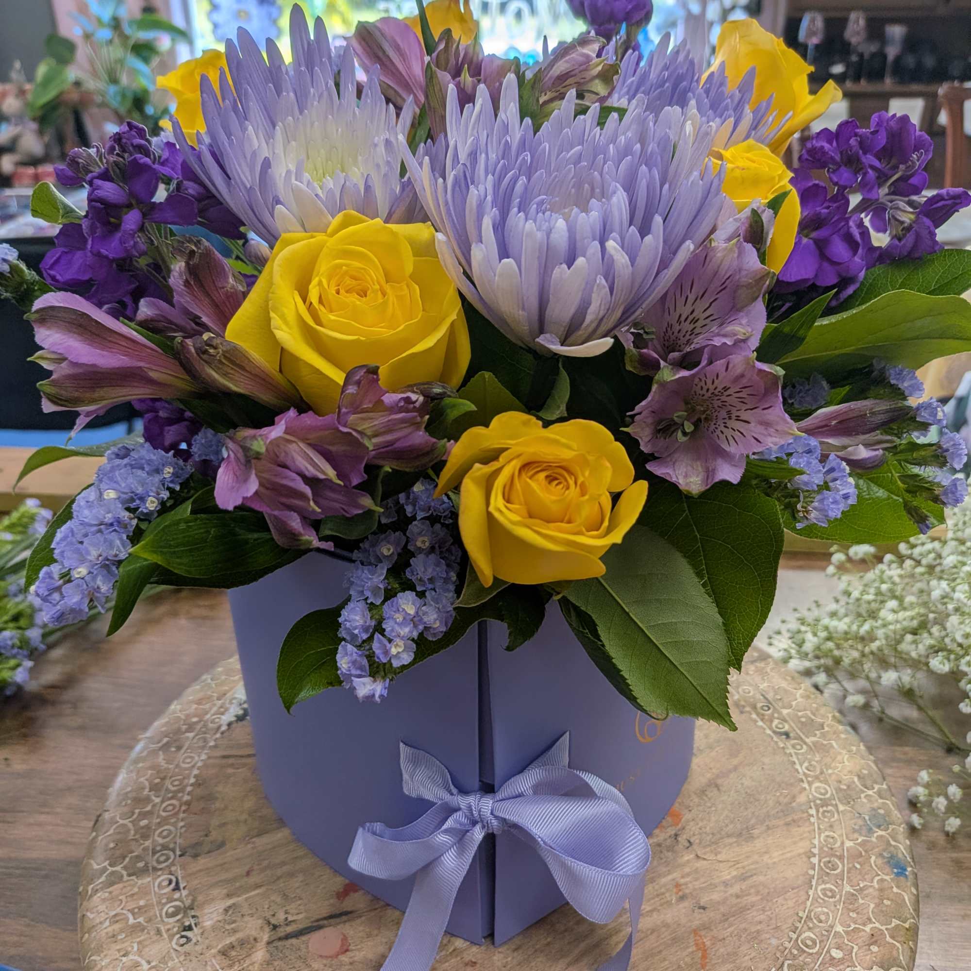 Double heart box with flowers and an added gift.