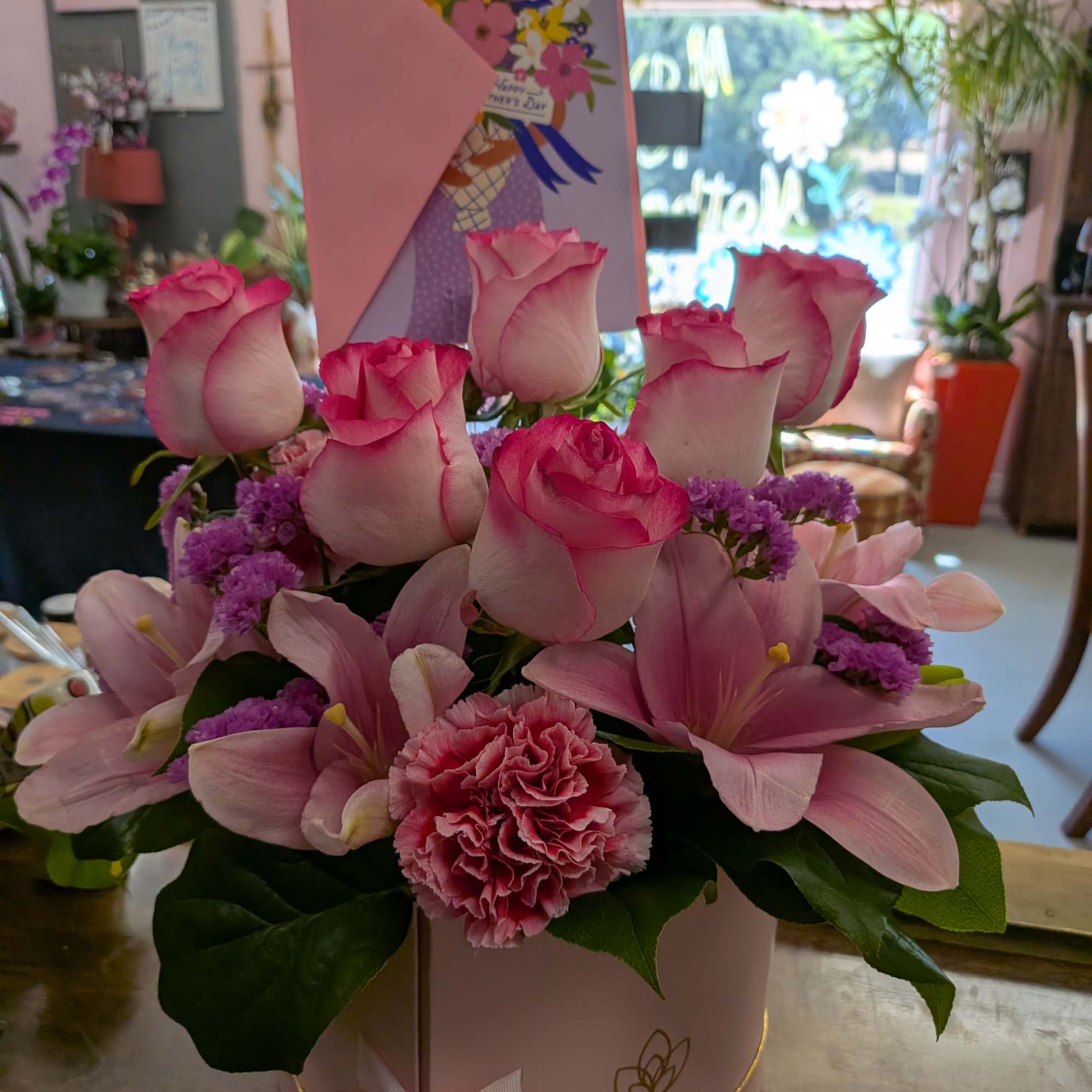 Double heart box with flowers and an added gift.