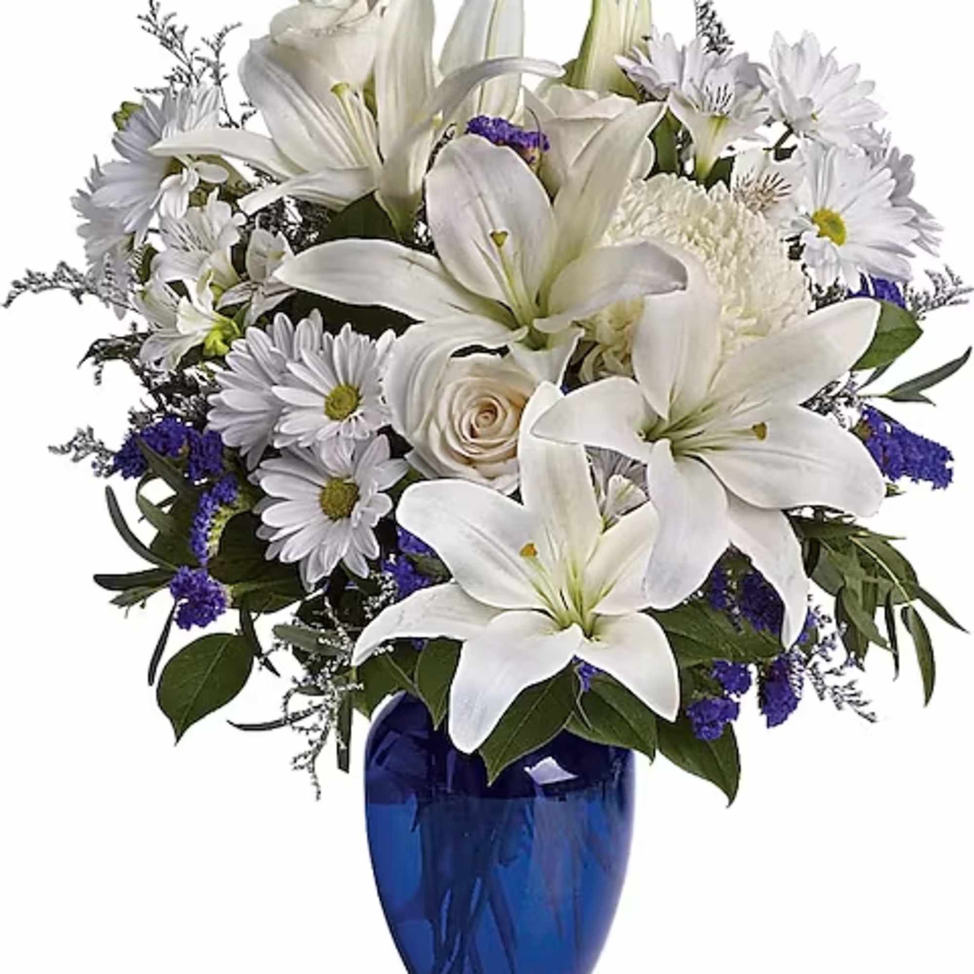 White lilies and daisies in a blue glass vase