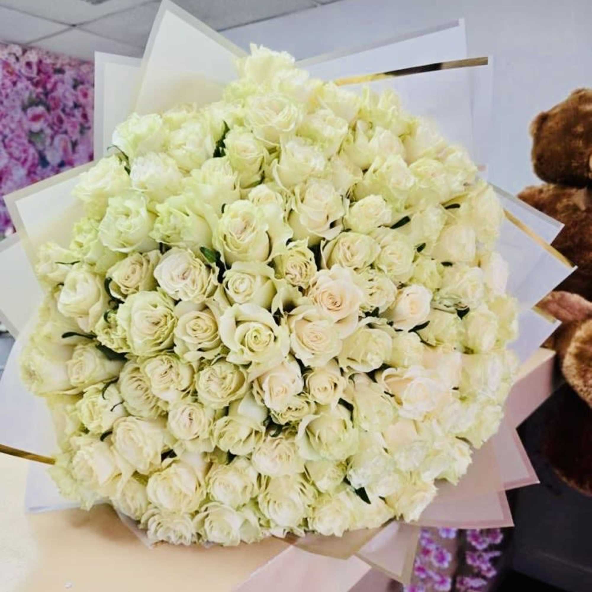 A classic, luxurious round bouquet crafted with premium fresh roses, carefully arranged