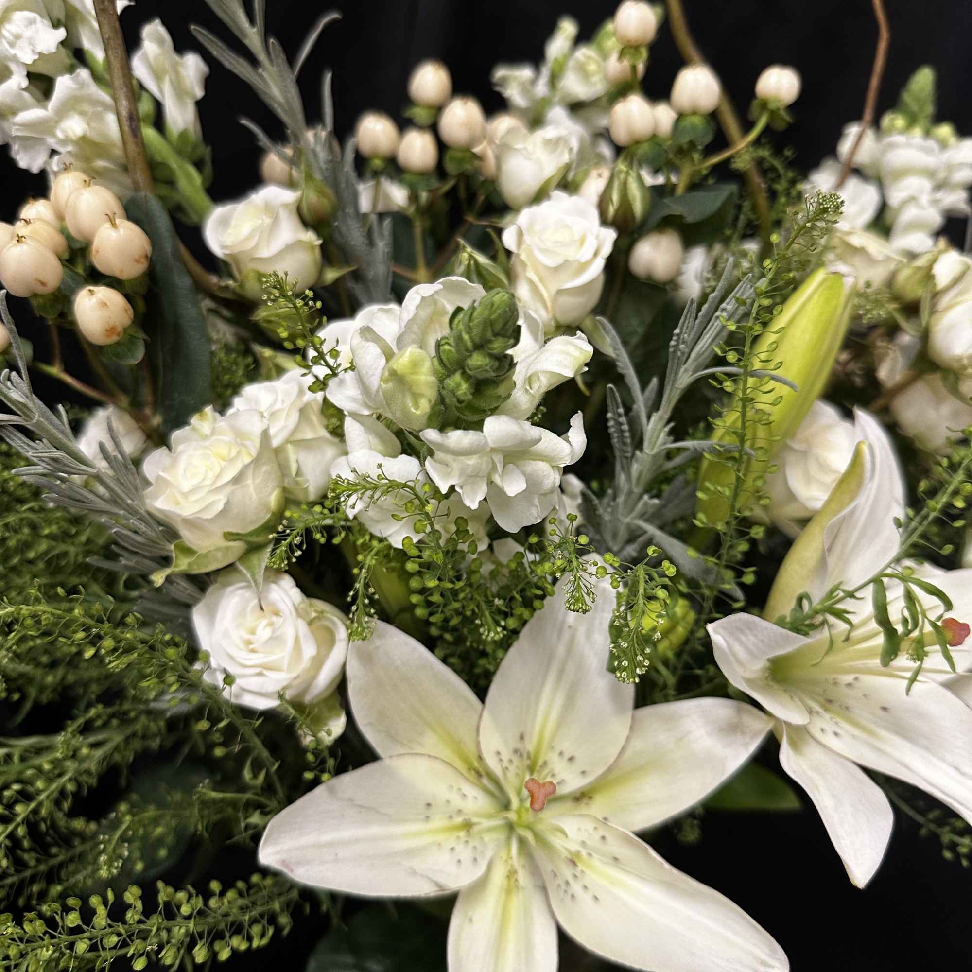 Serenity in blooms. This beautiful, two-toned arrangement is ideal for sympathy, weddings