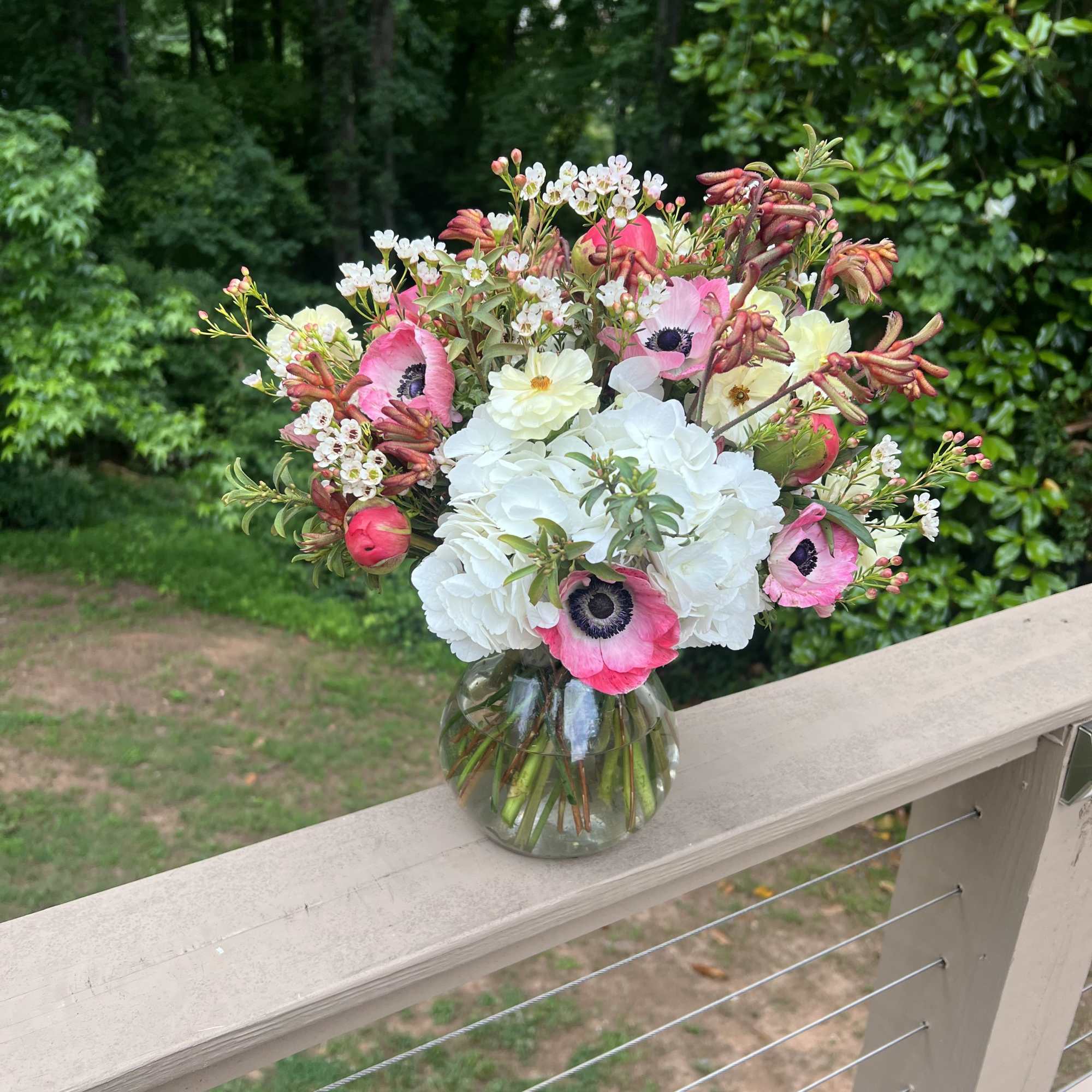 My signature. A rustic bouquet in a clear vase that shows off