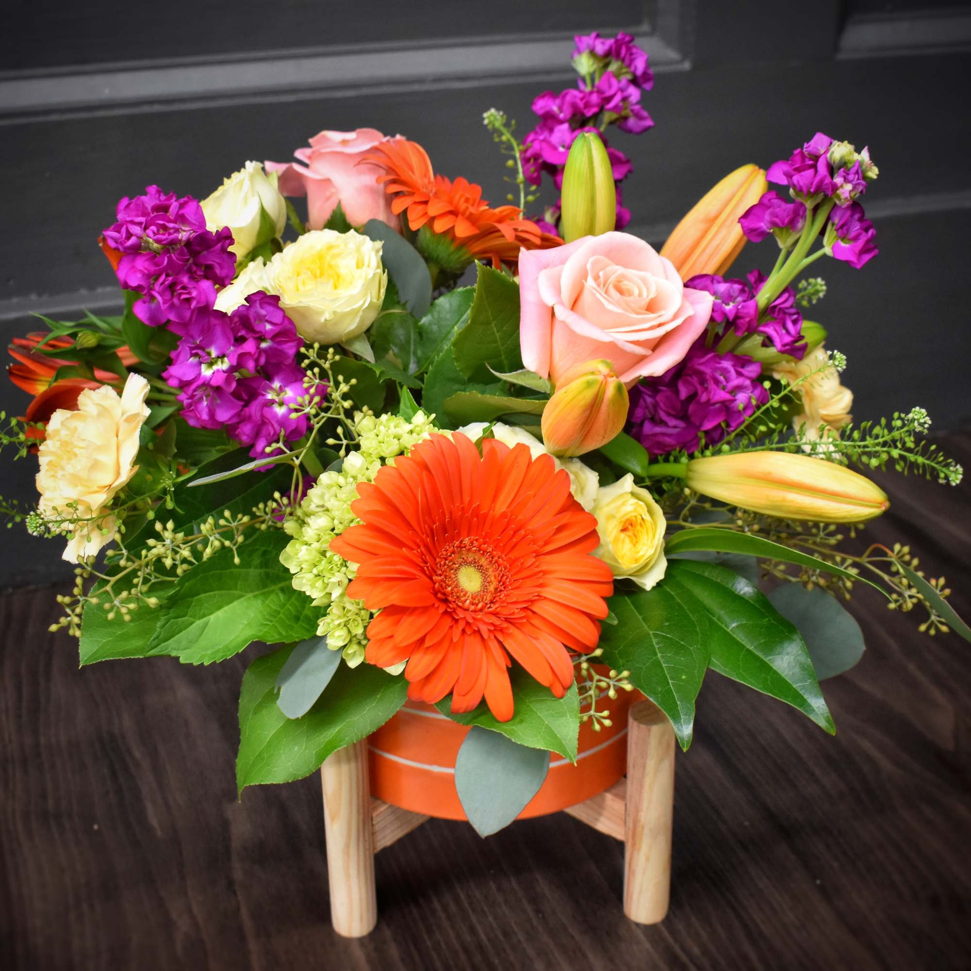 A bold orange gerbera takes center stage in this Sizzlin' Summer Blooms