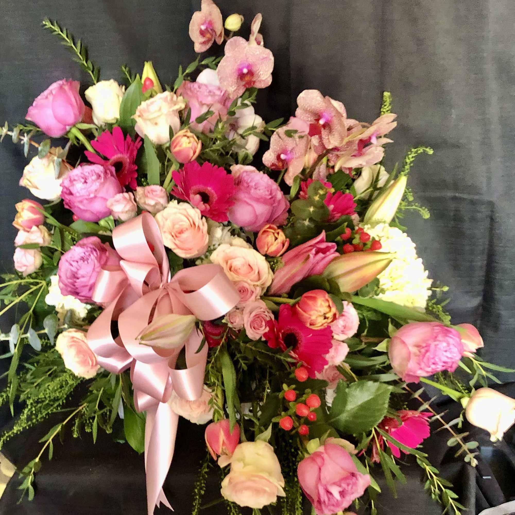 AN ASSORTMENT OF SEASONAL BLOOM IN A SMALL SUITCASE, photo 2 of 3