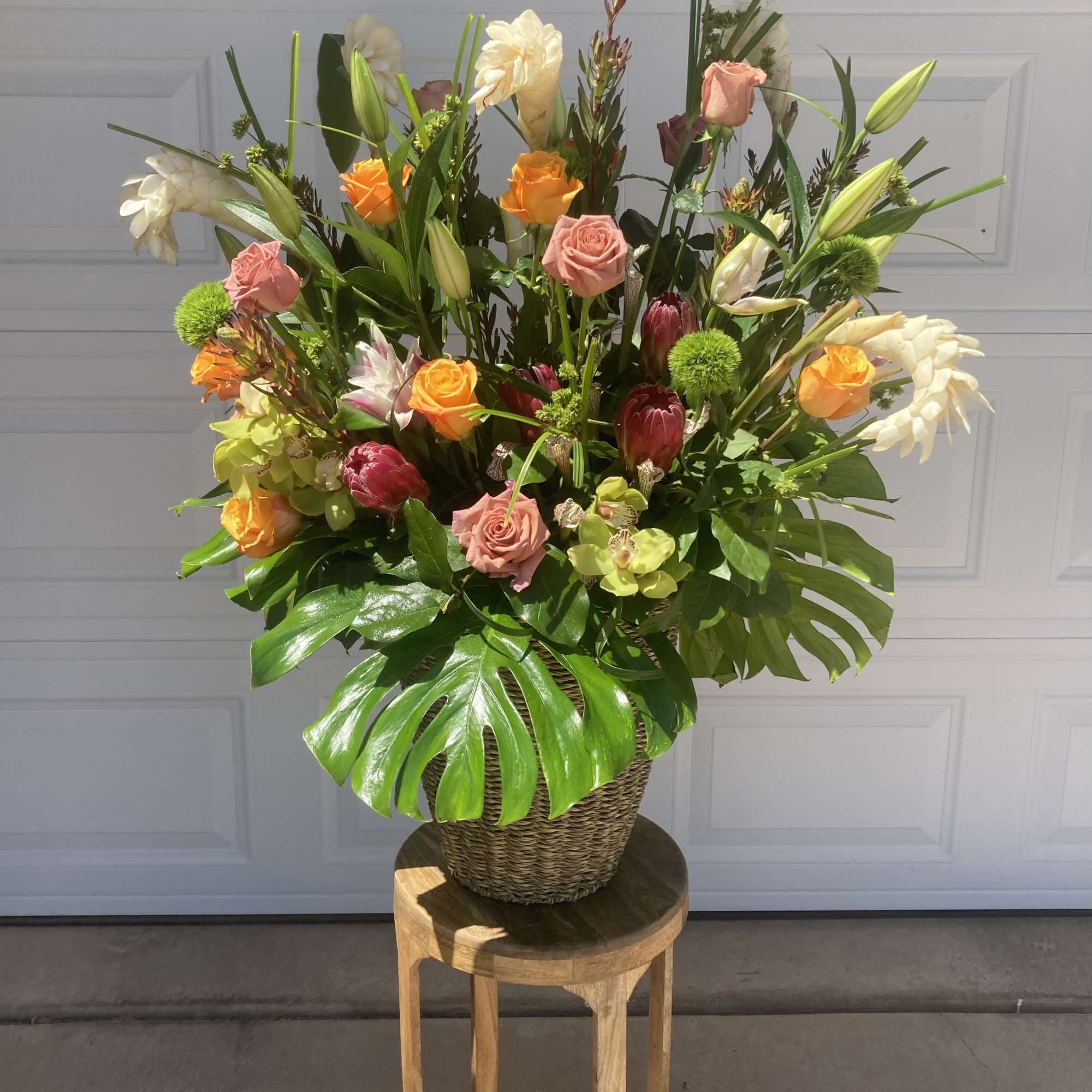 AN EXTRA LARGE TROPICAL FLORAL ARRANGEMENT, PERFECT TO CLEAR AWAY THE SHOWERS, photo 2 of 2