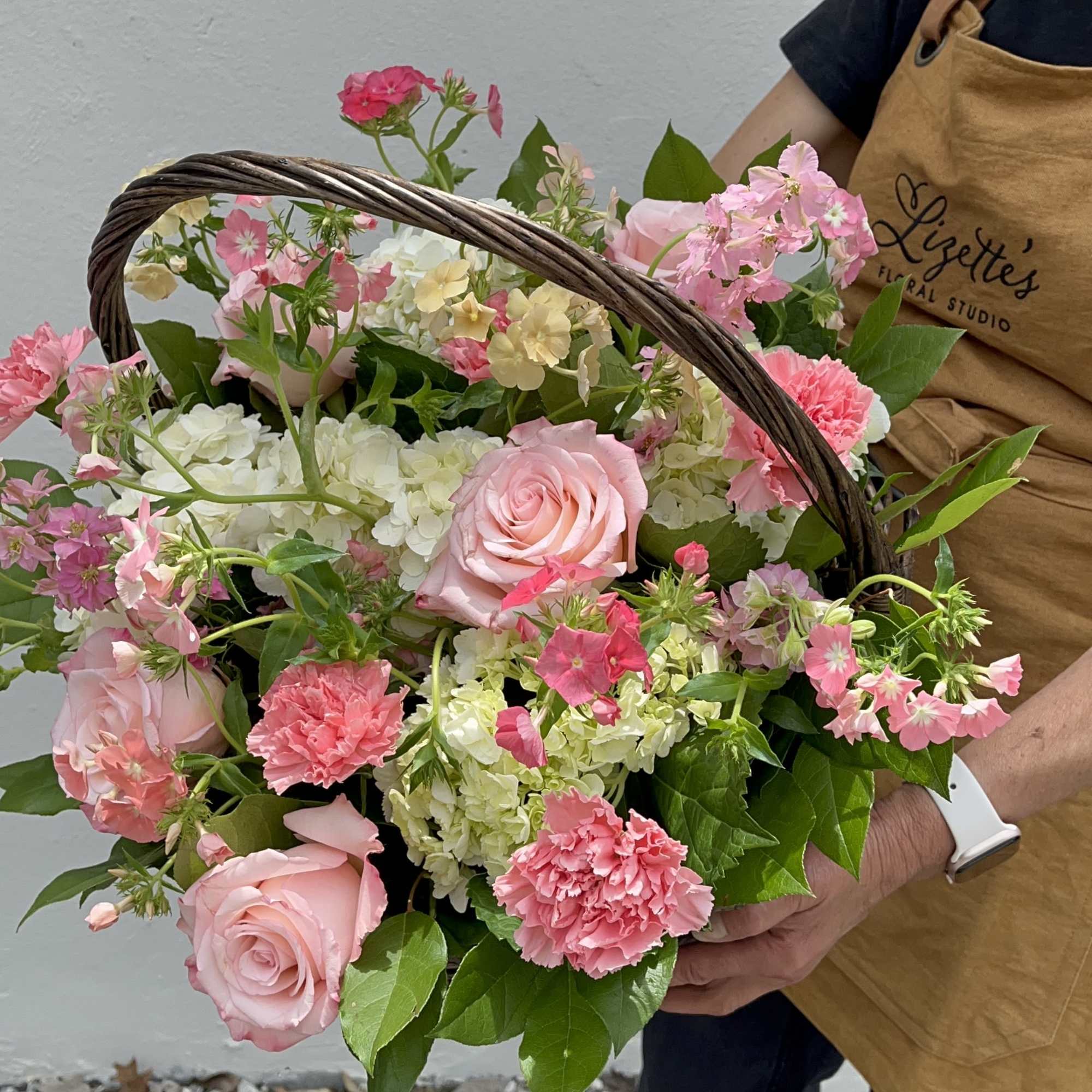 Surprise your loved ones with The Brambled, a rustic flower basket bursting