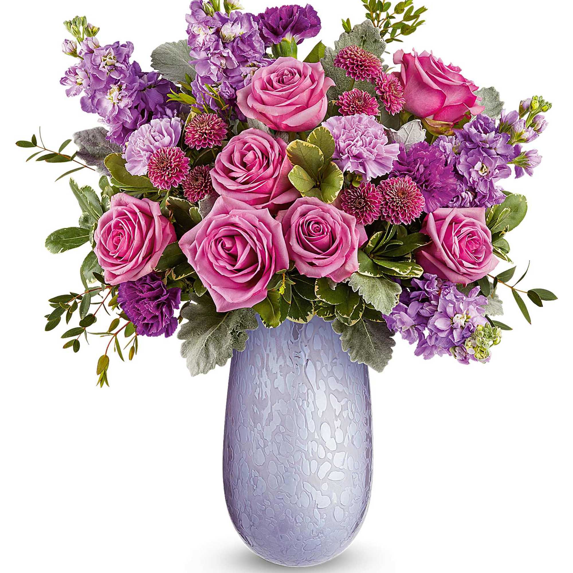 Pink and purple roses arranged in a lavender vase