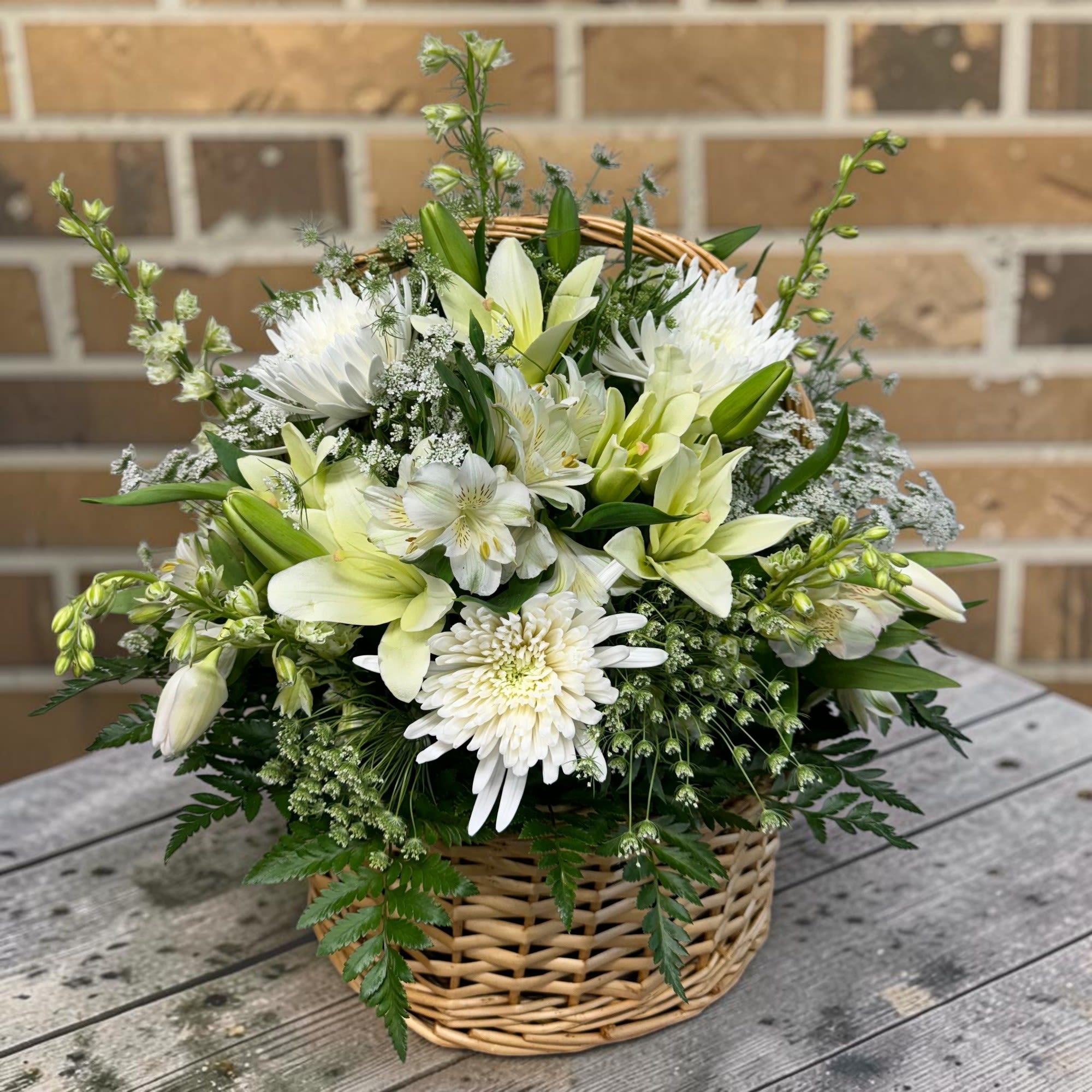 Fresh, elegant, and timeless, this all-white basket arrangement is a beautiful choice