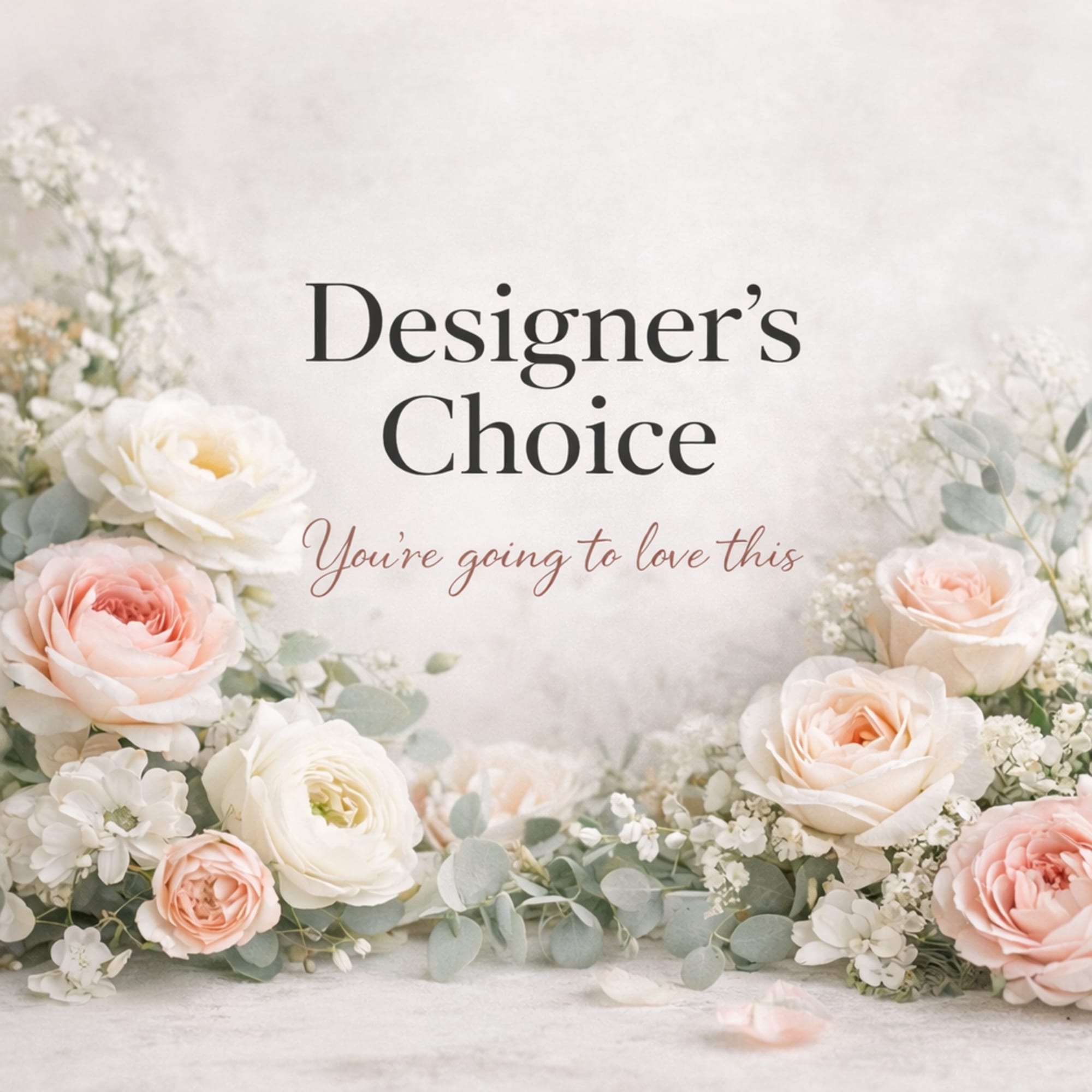 Pastel roses and white flowers framing a designer's choice sign
