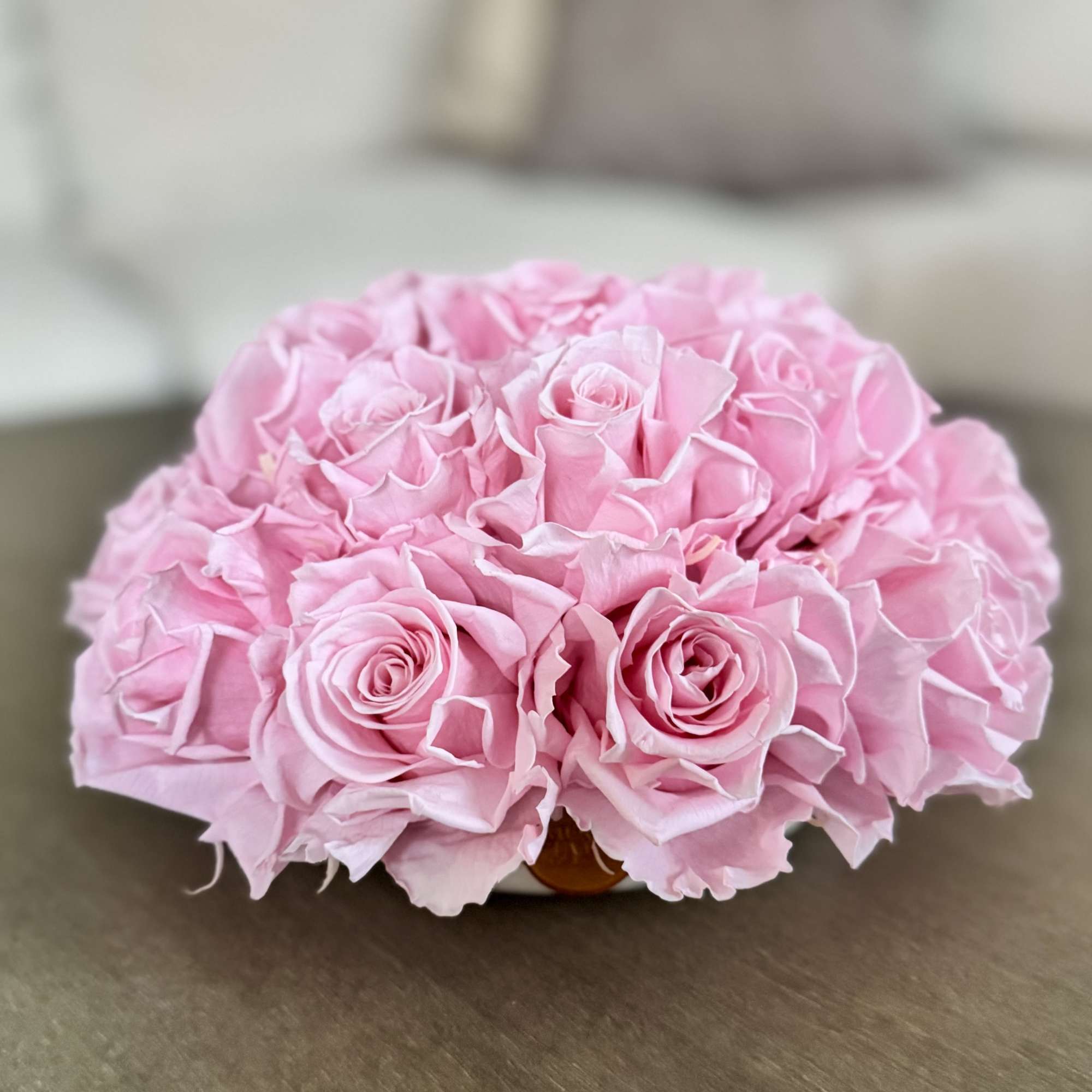 Cluster of pink roses arranged in a low bouquet
