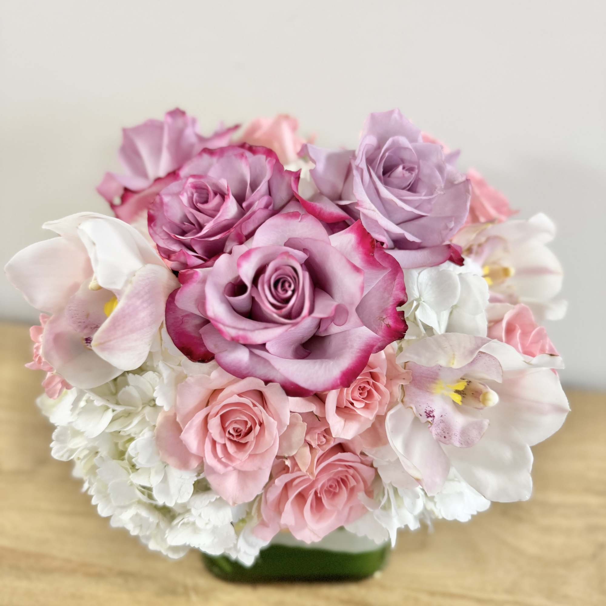 Classic and Beautiful, this large arrangement whispers luxury. Soft pinks, whites and
