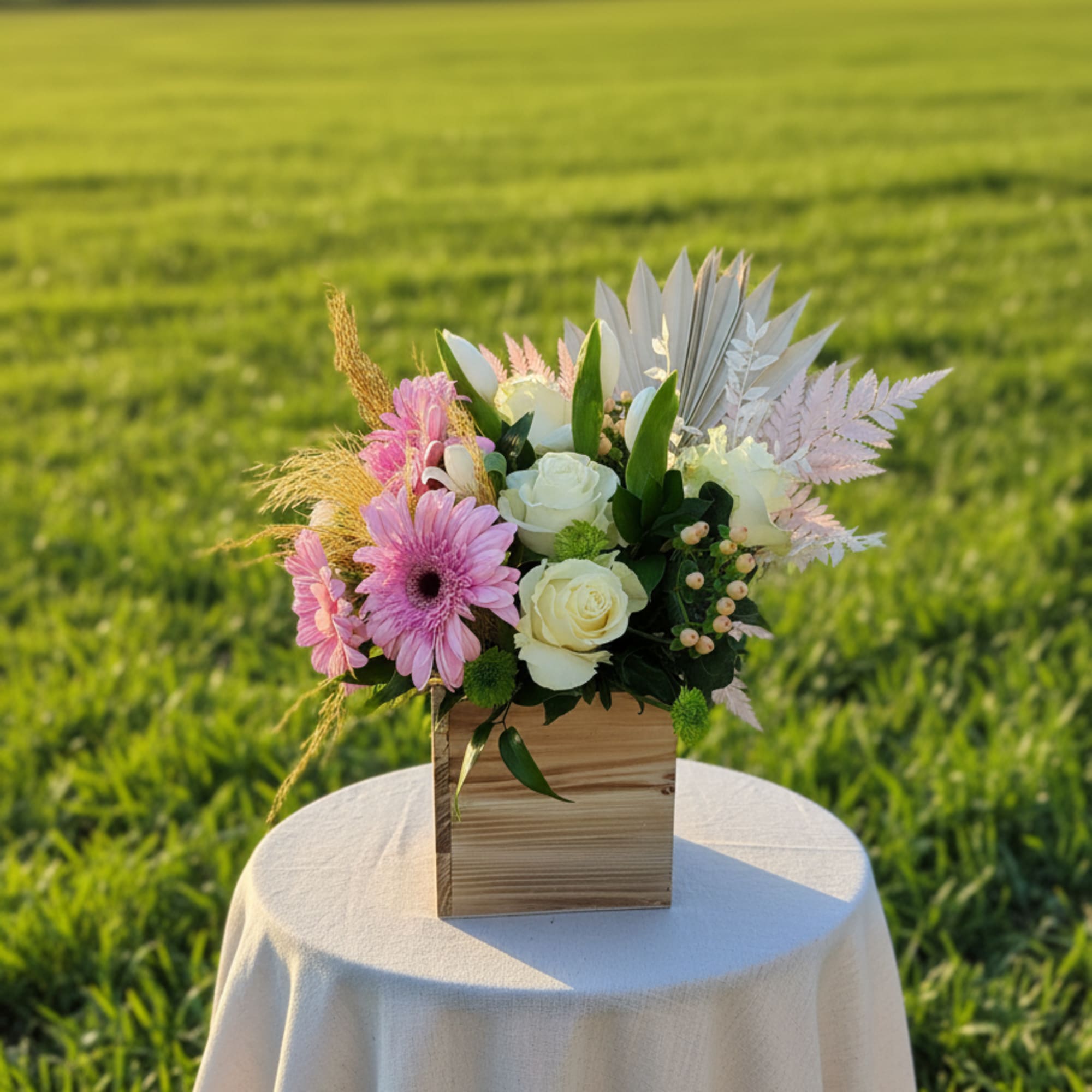 A boho arrangement featuring an eclectic mix of flowers and textures, this