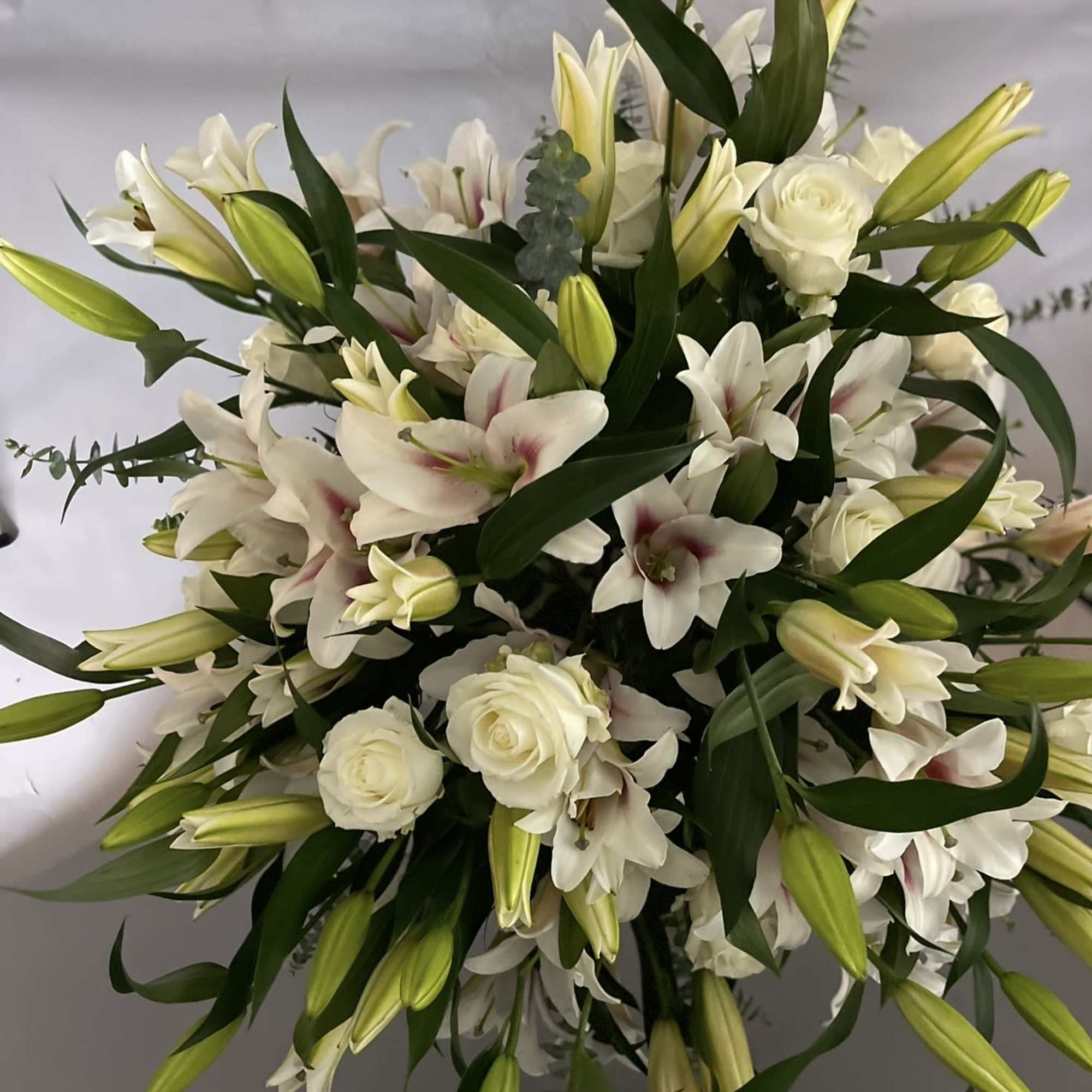 50 setms of lilies with 2 dozen white roses. 