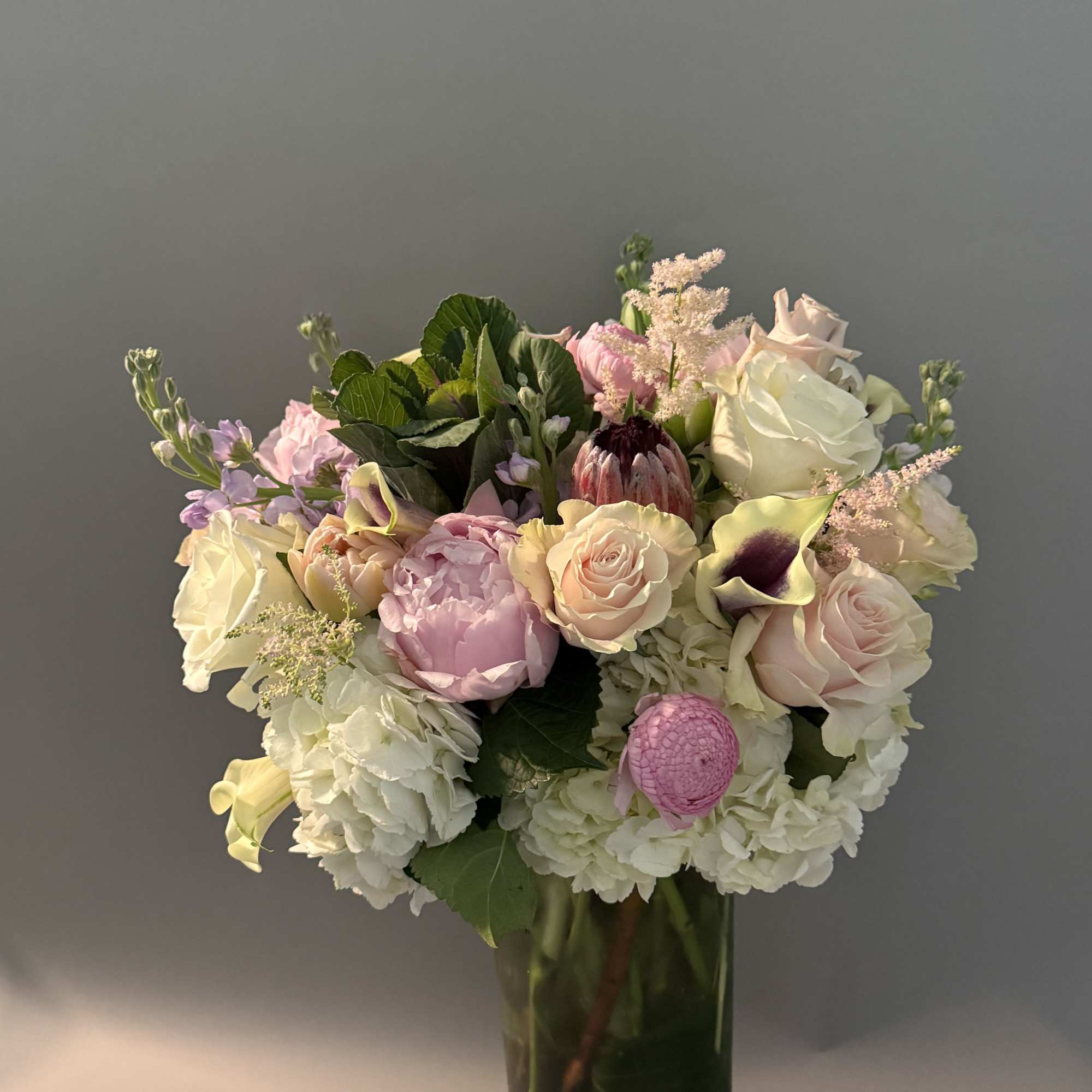 ***No specific delivery time available***
Peony and Calla color may vary without compromising