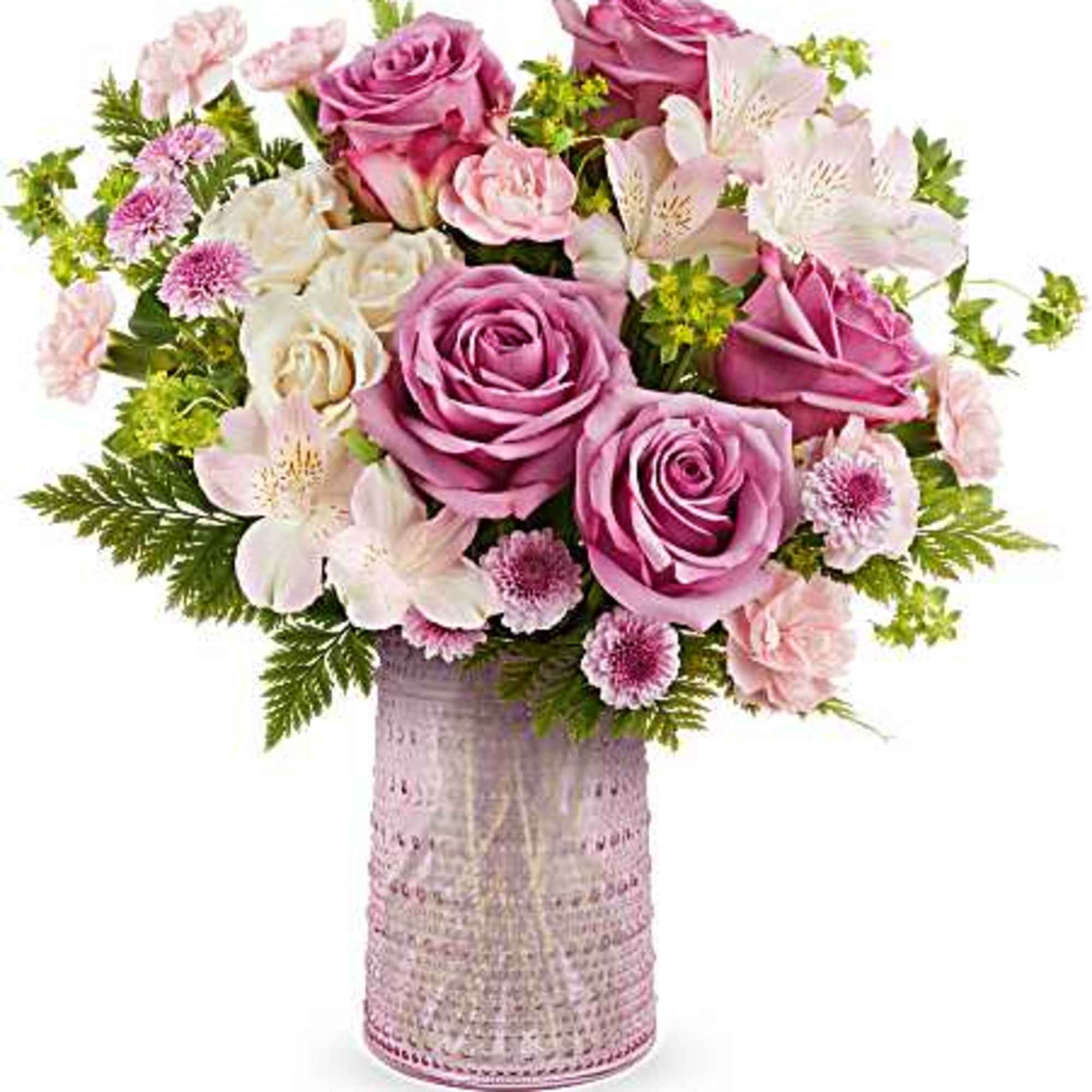 Pink and white rose bouquet in a textured glass vase
