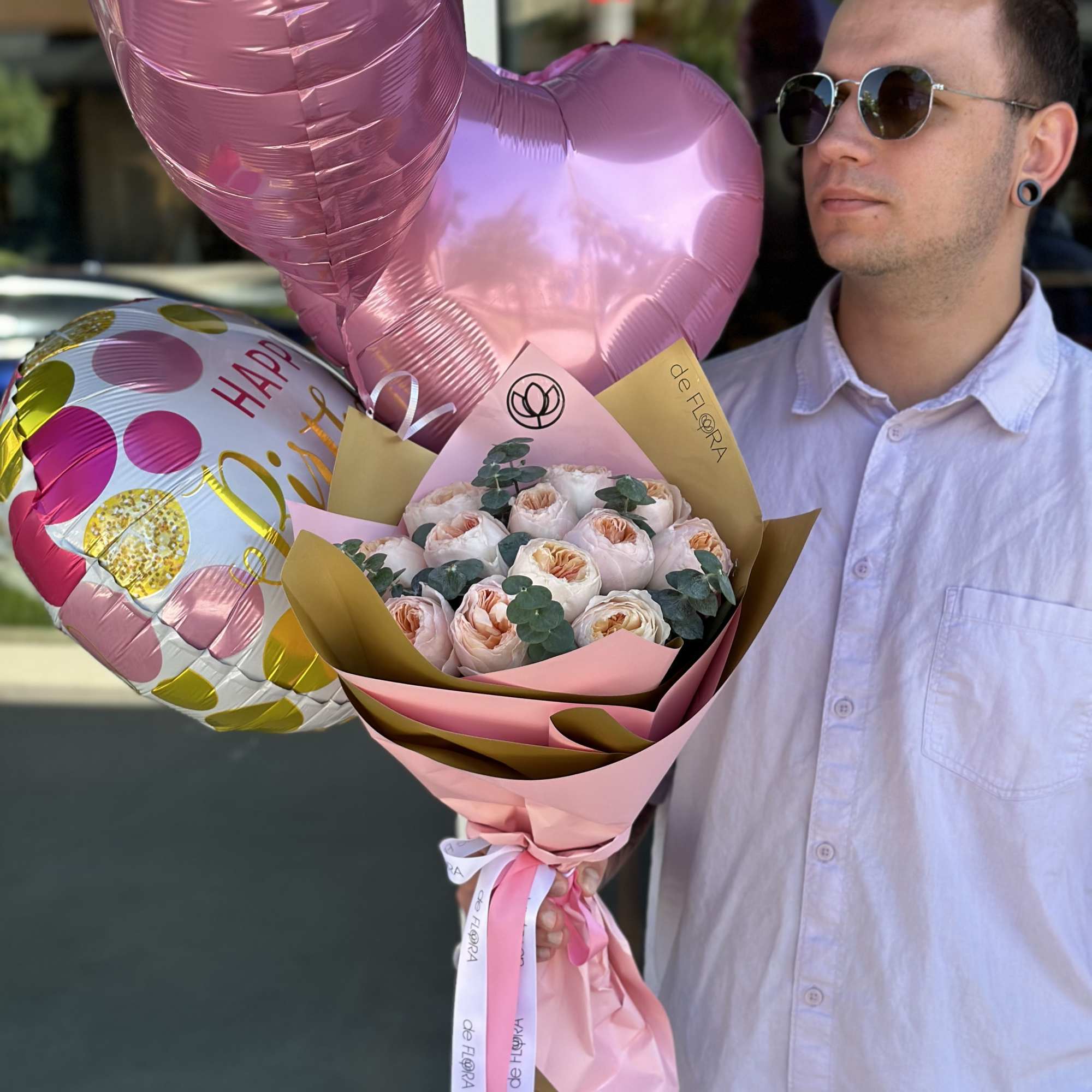 Pink rose bouquet with heart-shaped balloons