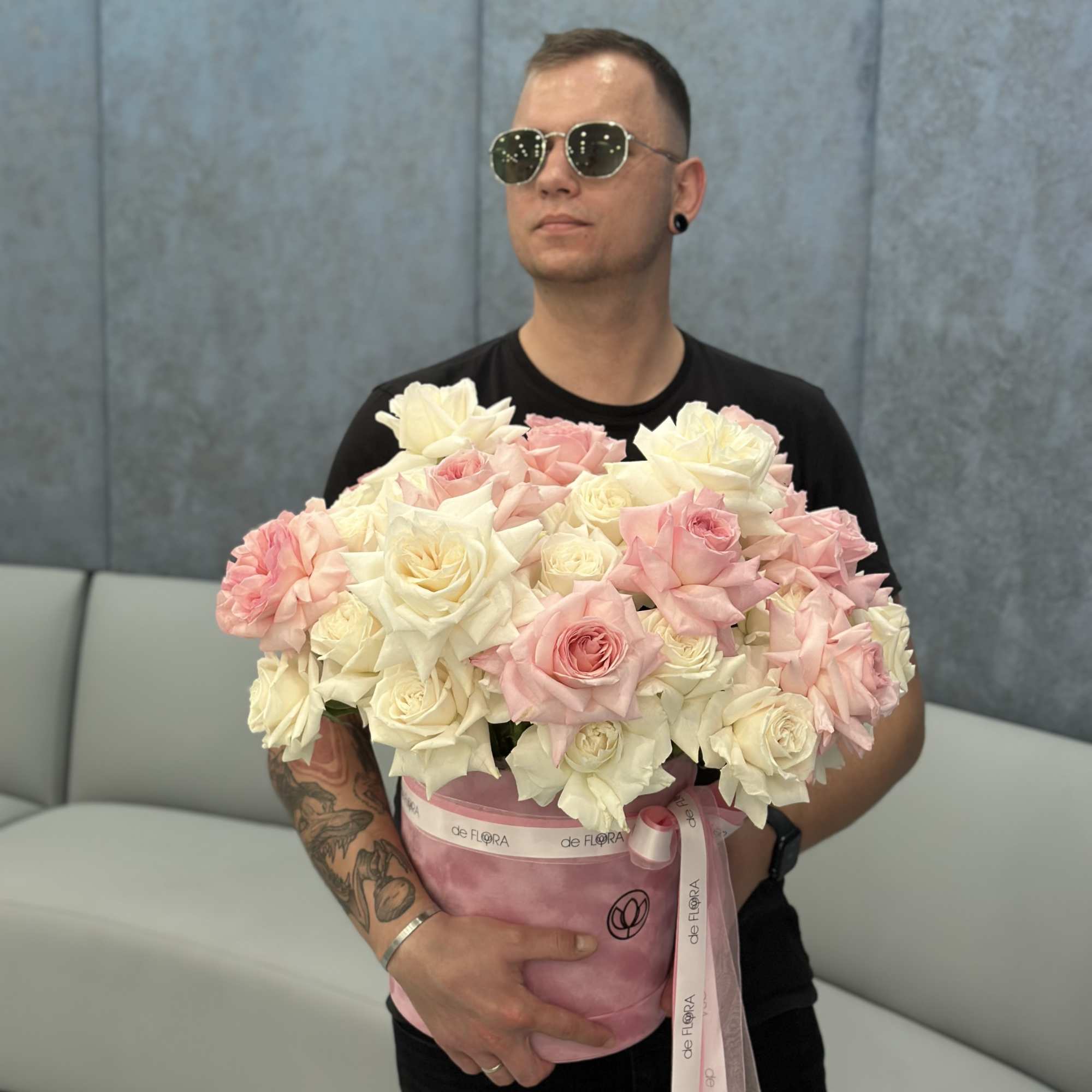 Large pink and white rose bouquet in a pink hatbox with ribbon