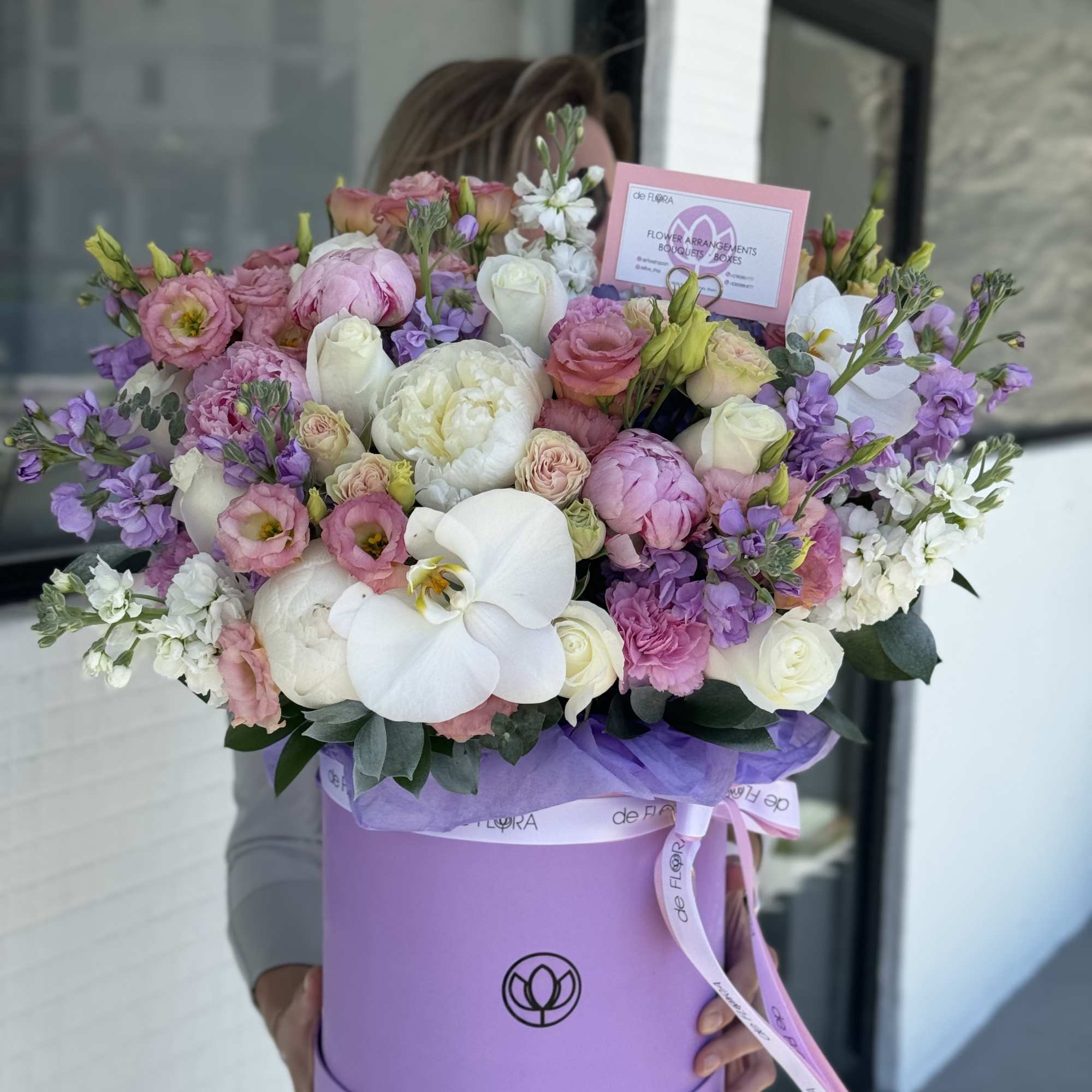 Large pastel bouquet in a lavender hat box with pink, white, and purple blooms