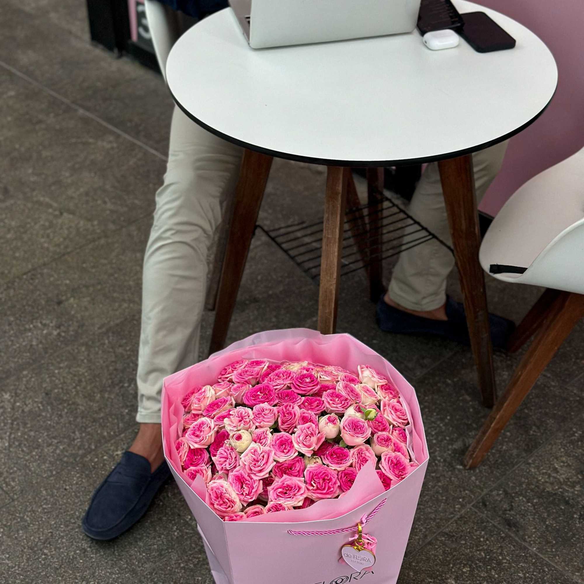 Large pink bouquet of roses in a pastel gift box
