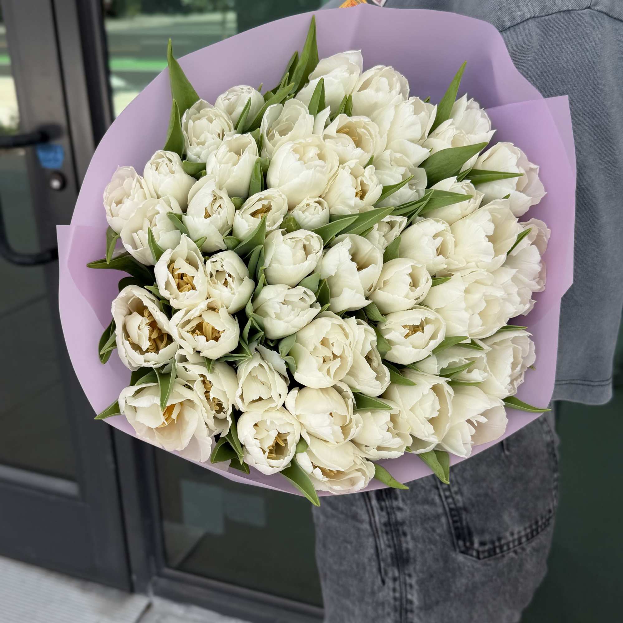 Bouquet of white tulips wrapped in lavender paper, photo 3 of 3