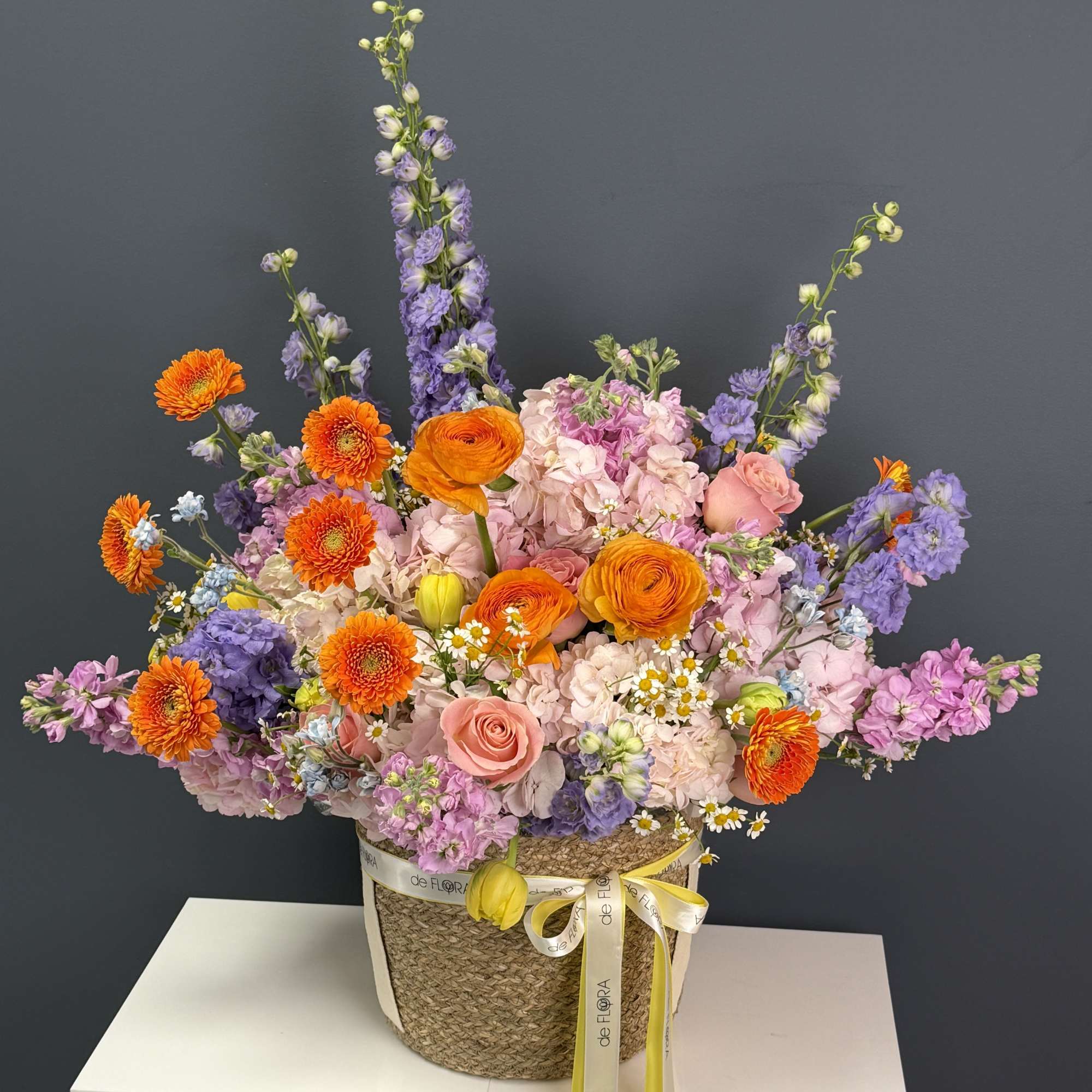 A vibrant, garden-style arrangement bursting with life and color. This basket features, photo 2 of 3