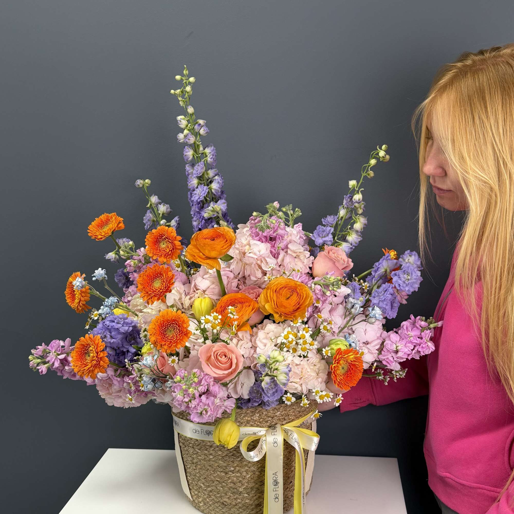 A vibrant, garden-style arrangement bursting with life and color. This basket features