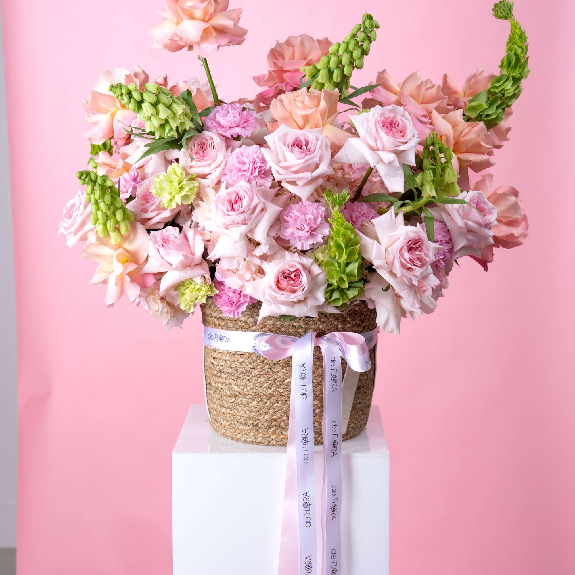 Soft blush and peach roses mingle with ruffled pink carnations in a, photo 2 of 4