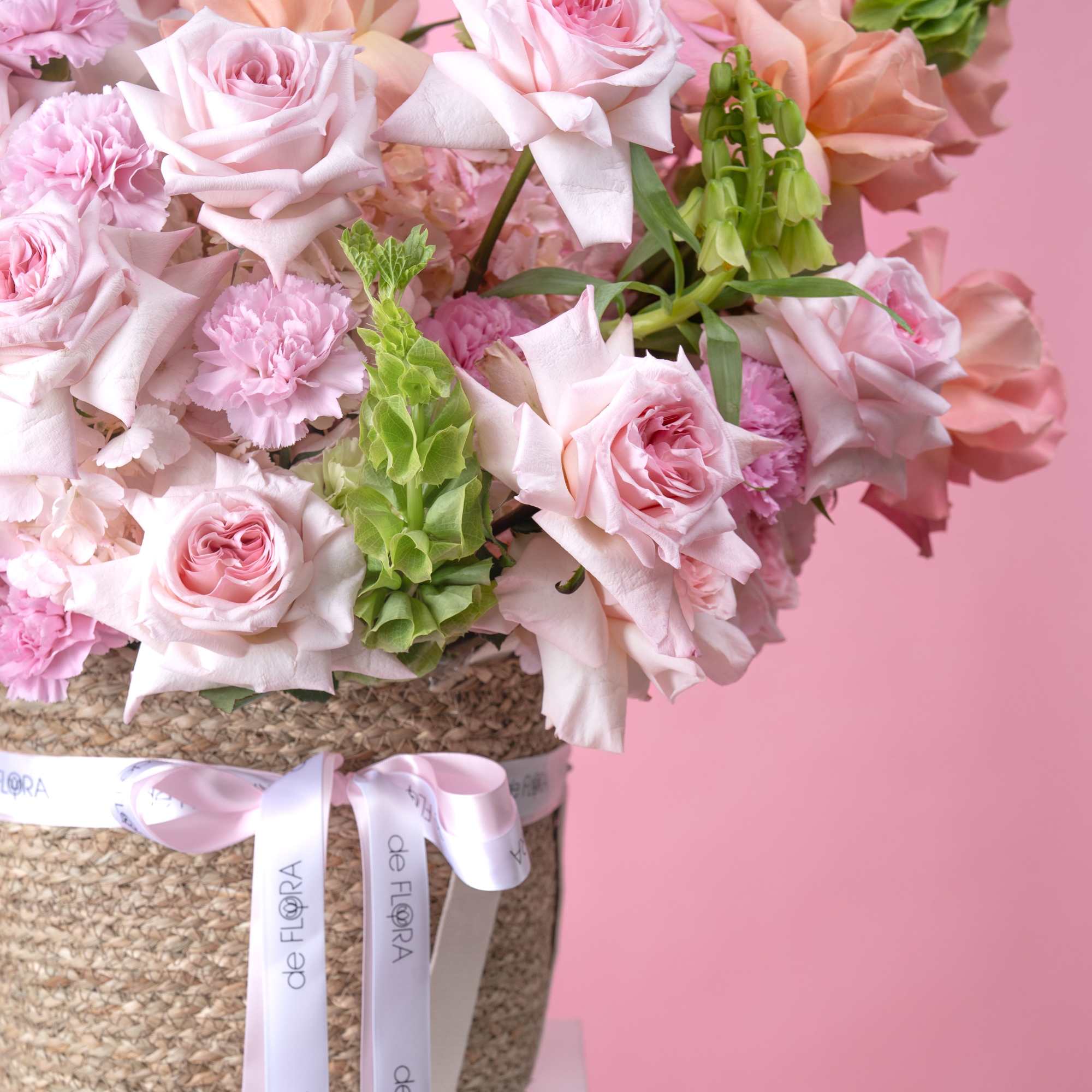 Soft blush and peach roses mingle with ruffled pink carnations in a, photo 4 of 4