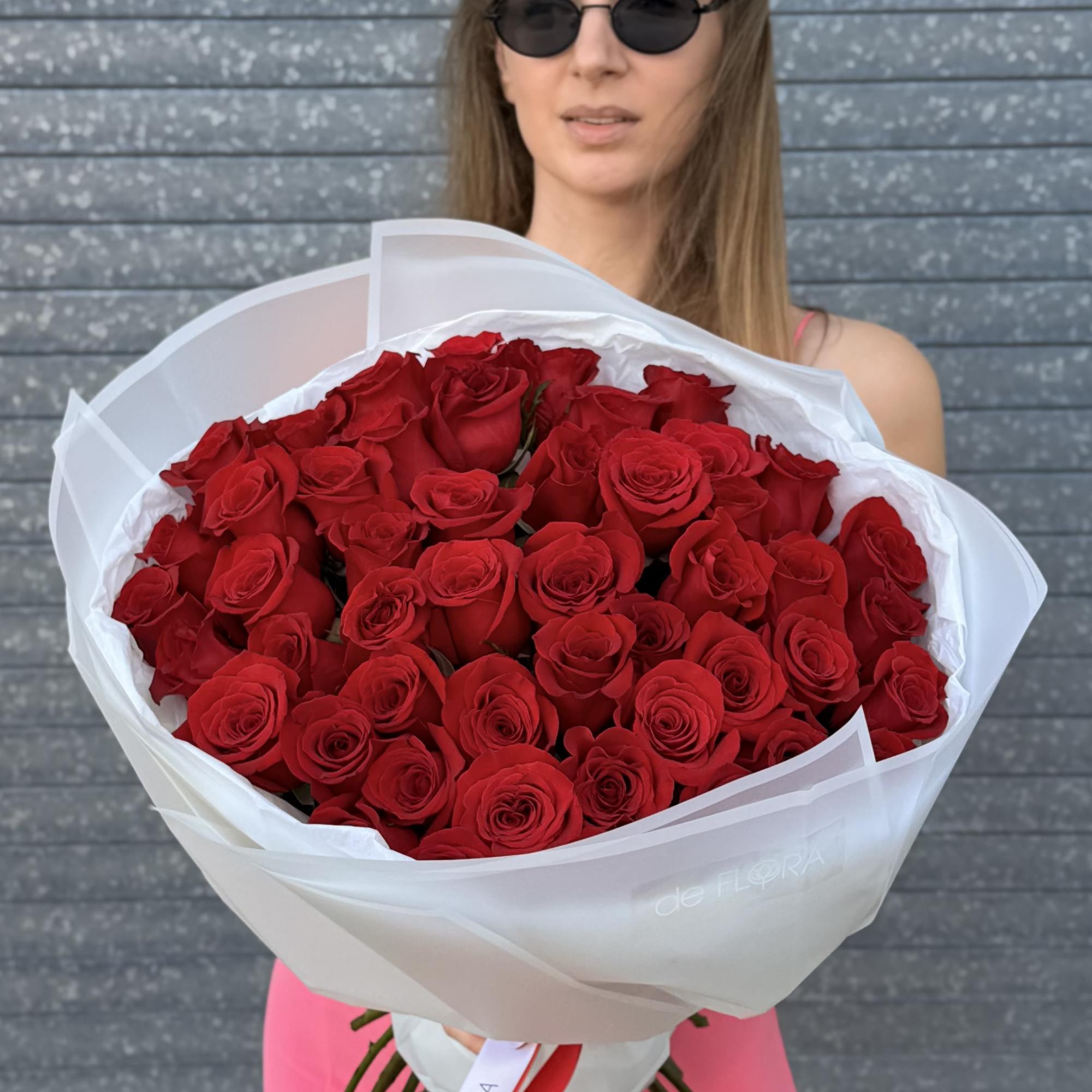 A striking bouquet of deep red roses &mdash; the eternal emblem of