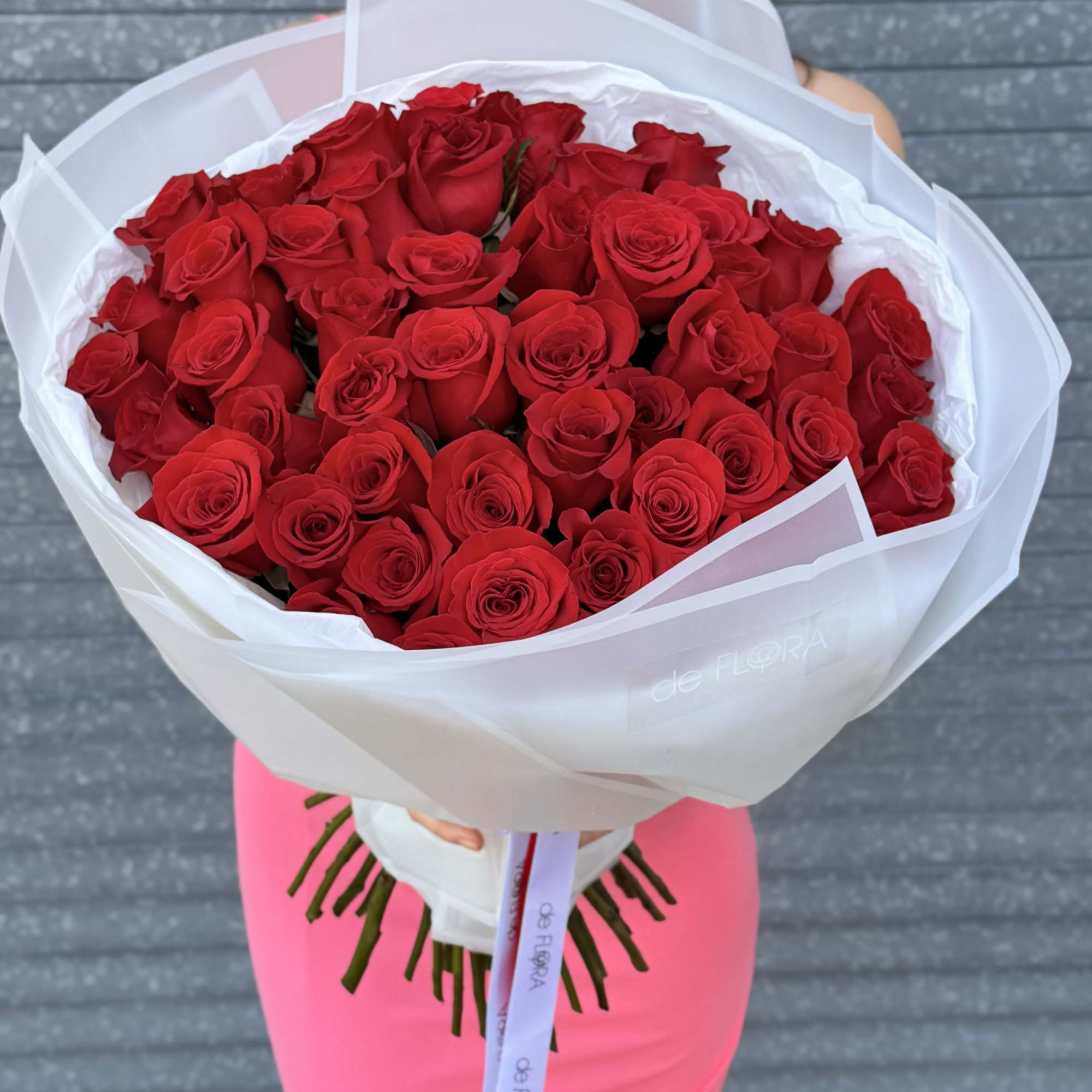 A striking bouquet of deep red roses &mdash; the eternal emblem of