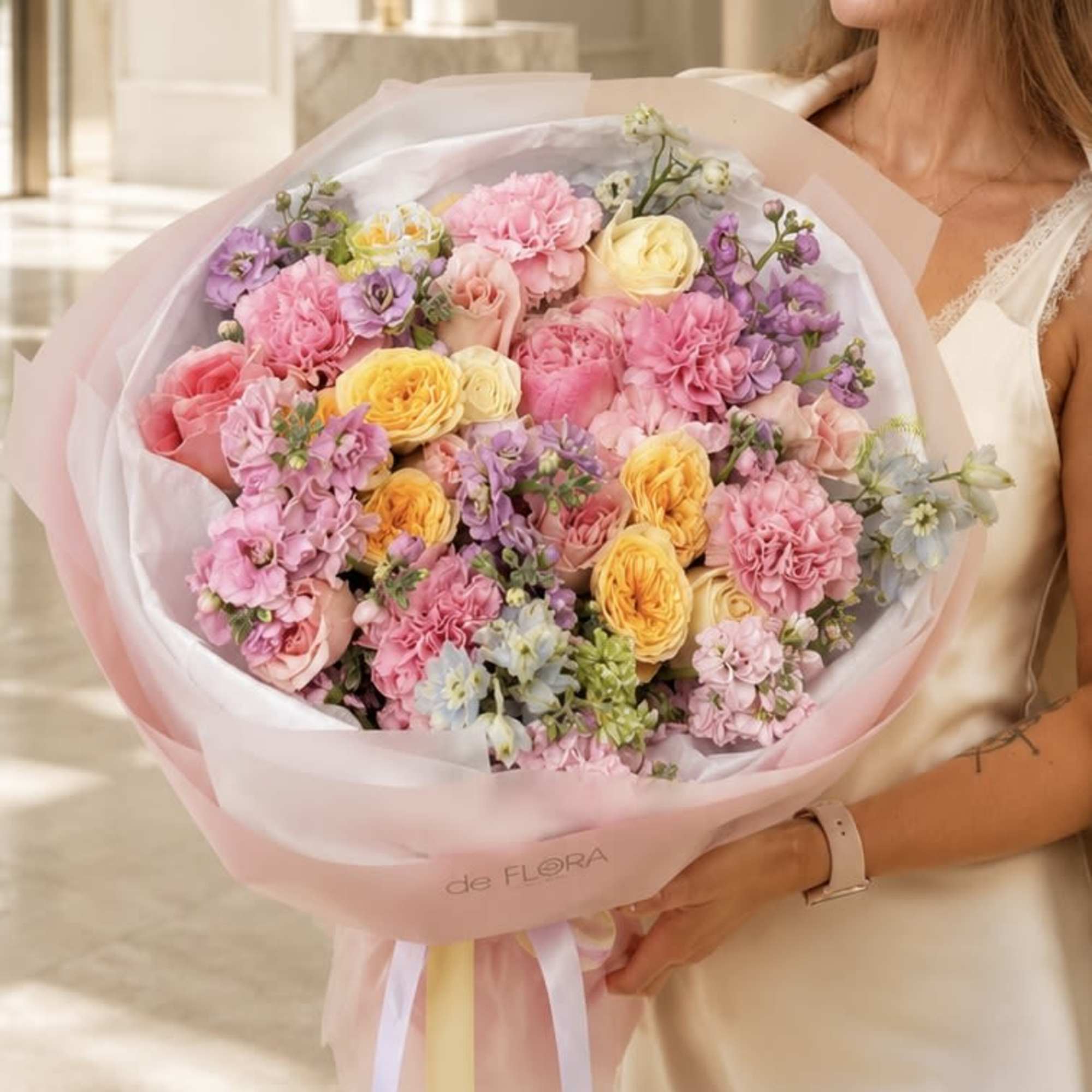 Blush Sonata is a luxurious garden-style bouquet handcrafted with premium peonies, garden