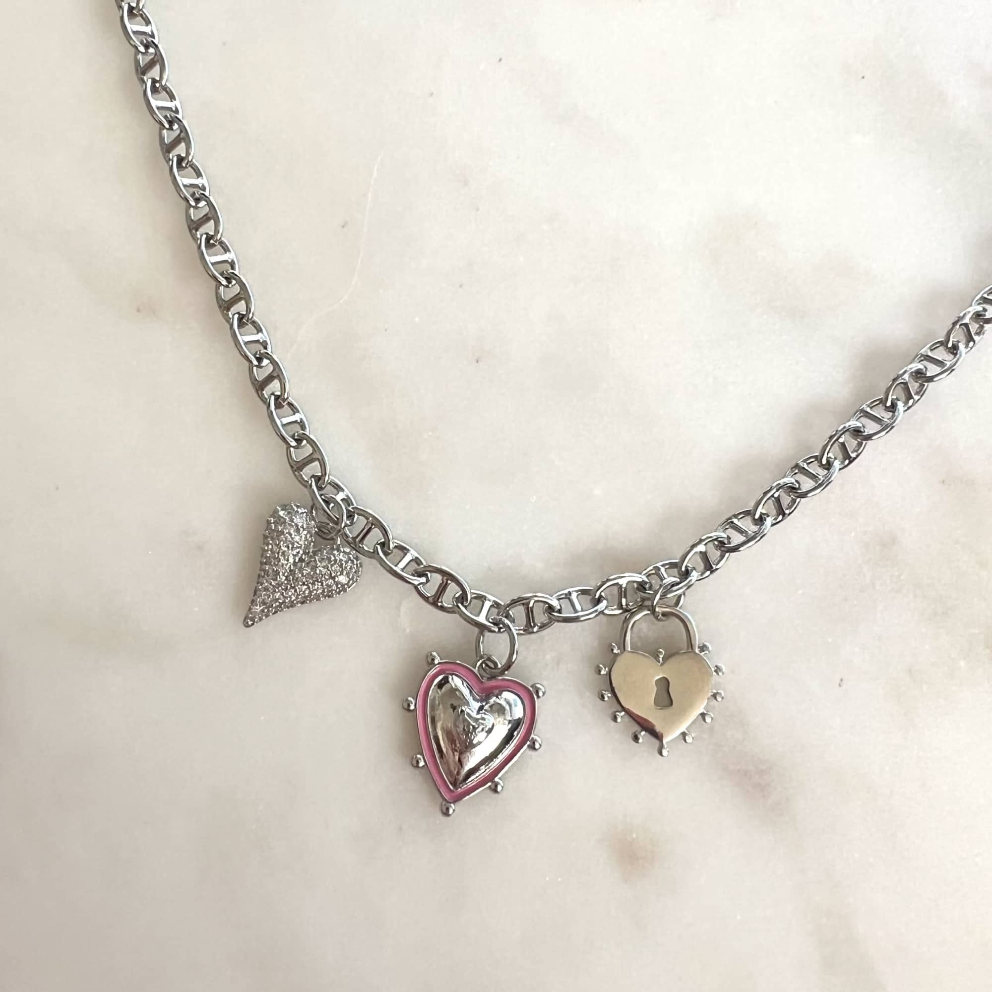 Silver charm necklace with heart and lock pendants