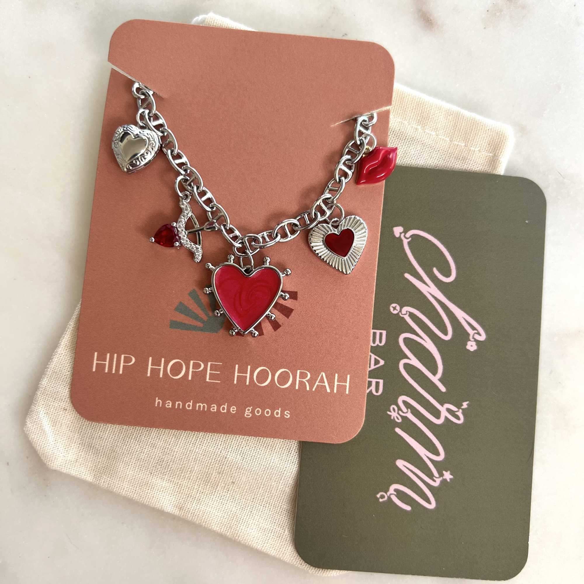 Heart charm bracelet on branded display cards