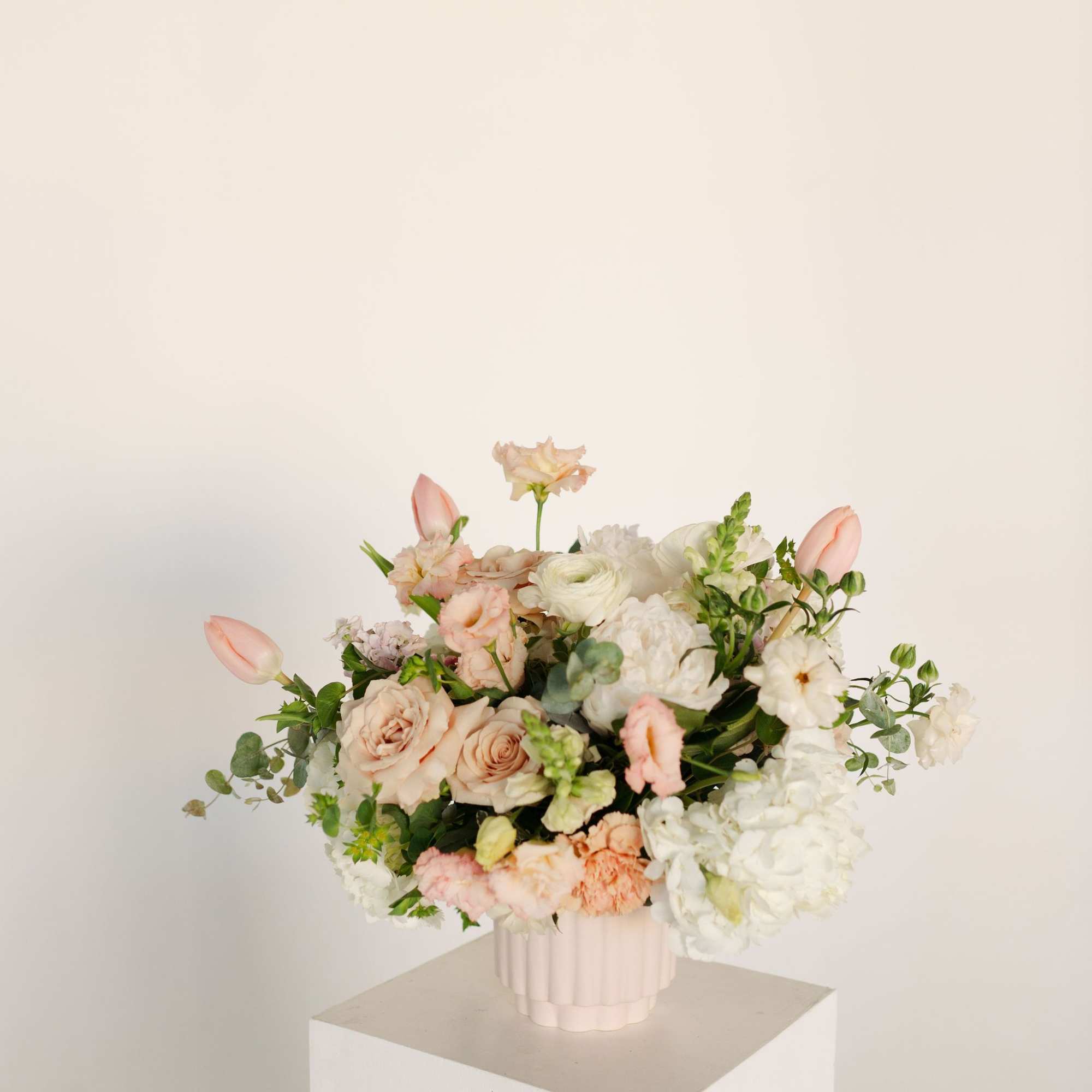The sweetest, prettiest arrangement for the loveliest person you know. Featuring blush
