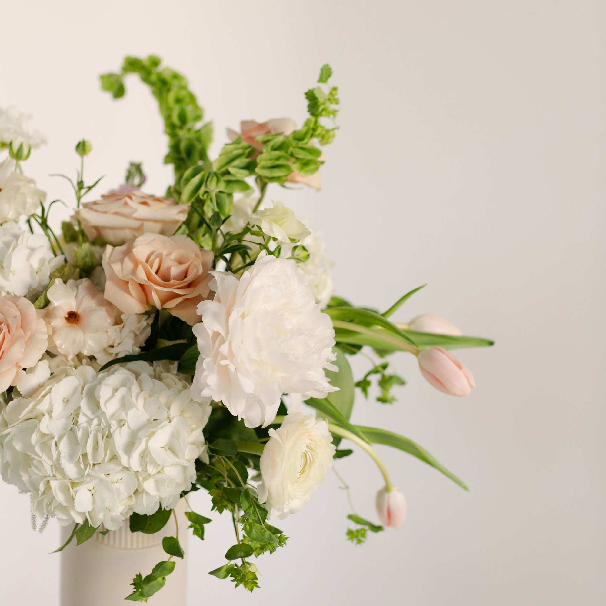 A sweet, pretty arrangement with a sassy edge, this modern twist on