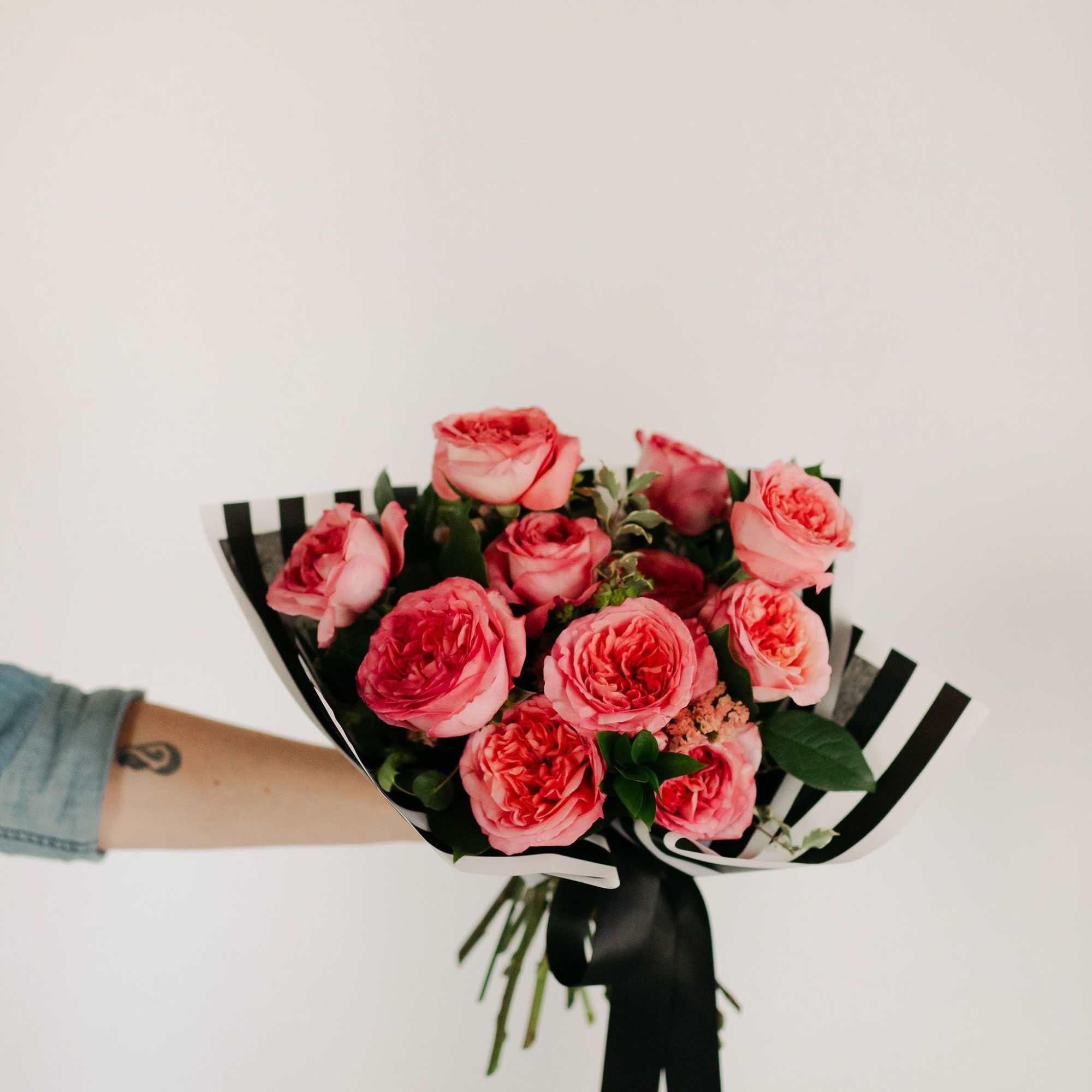 A soft, lush pink hand-tied bouquet featuring premium roses. Simple, classic, timeless!

If