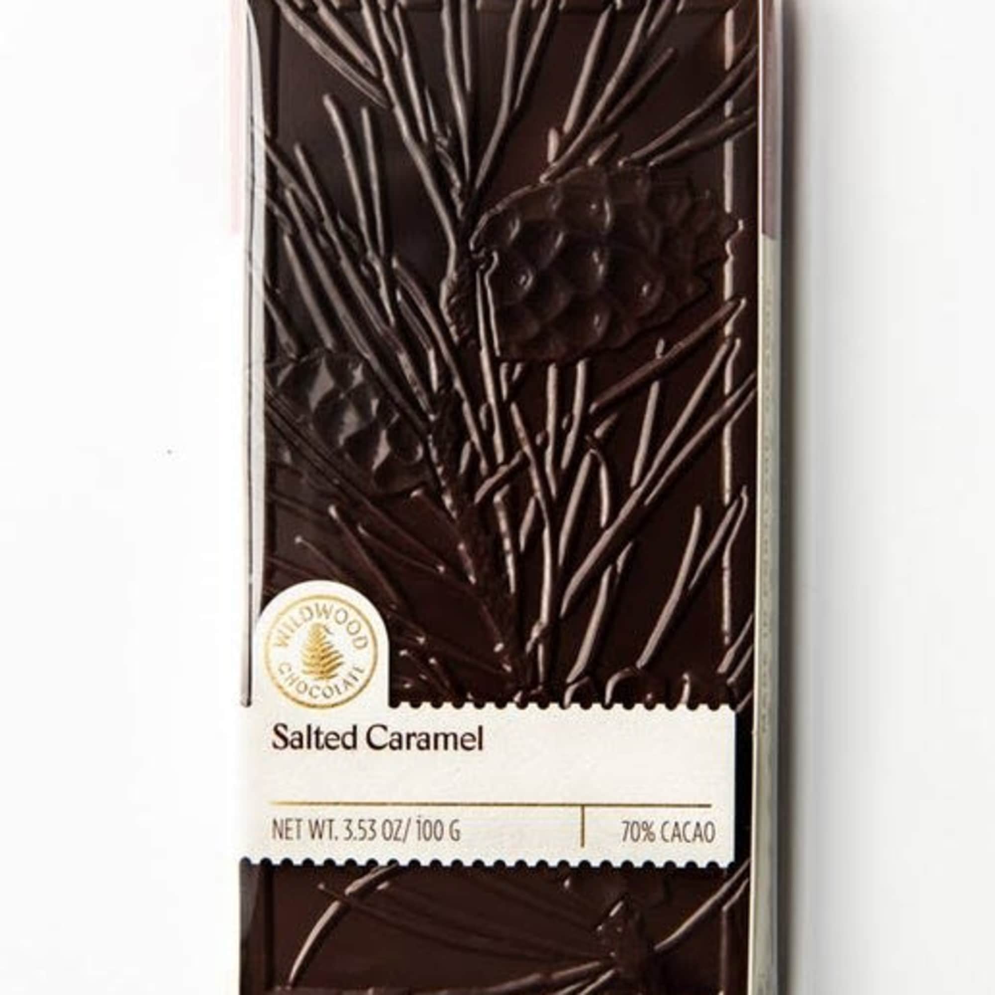 Bar of dark chocolate in a clear wrapper labeled salted caramel