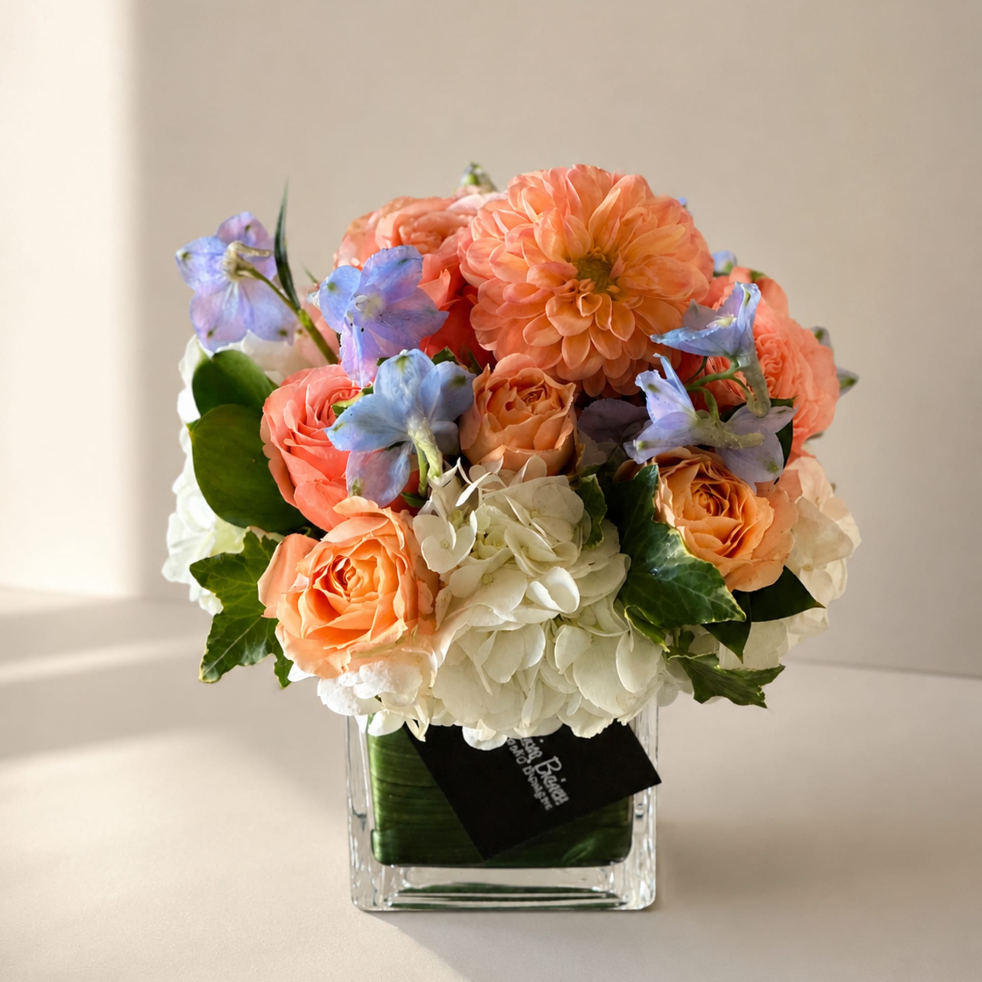 Sweet, graceful, and effortlessly elegant, Dottie is a garden-inspired flower arrangement designed