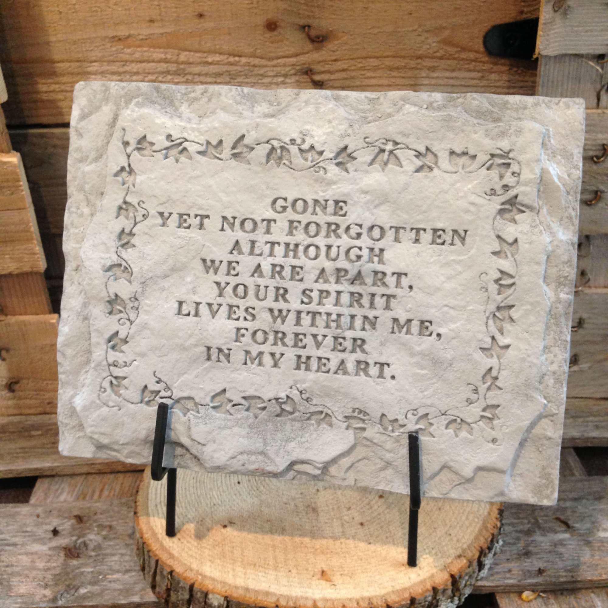 Memorial stone plaque with an engraved remembrance message