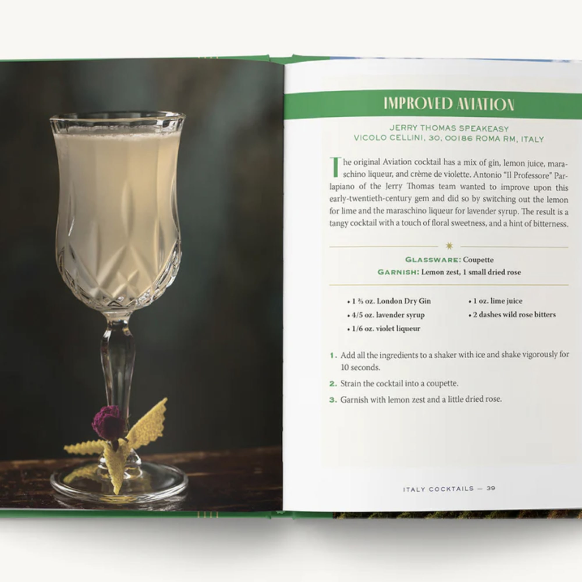 Open cocktail book showing a drink in a stemmed glass and a recipe page