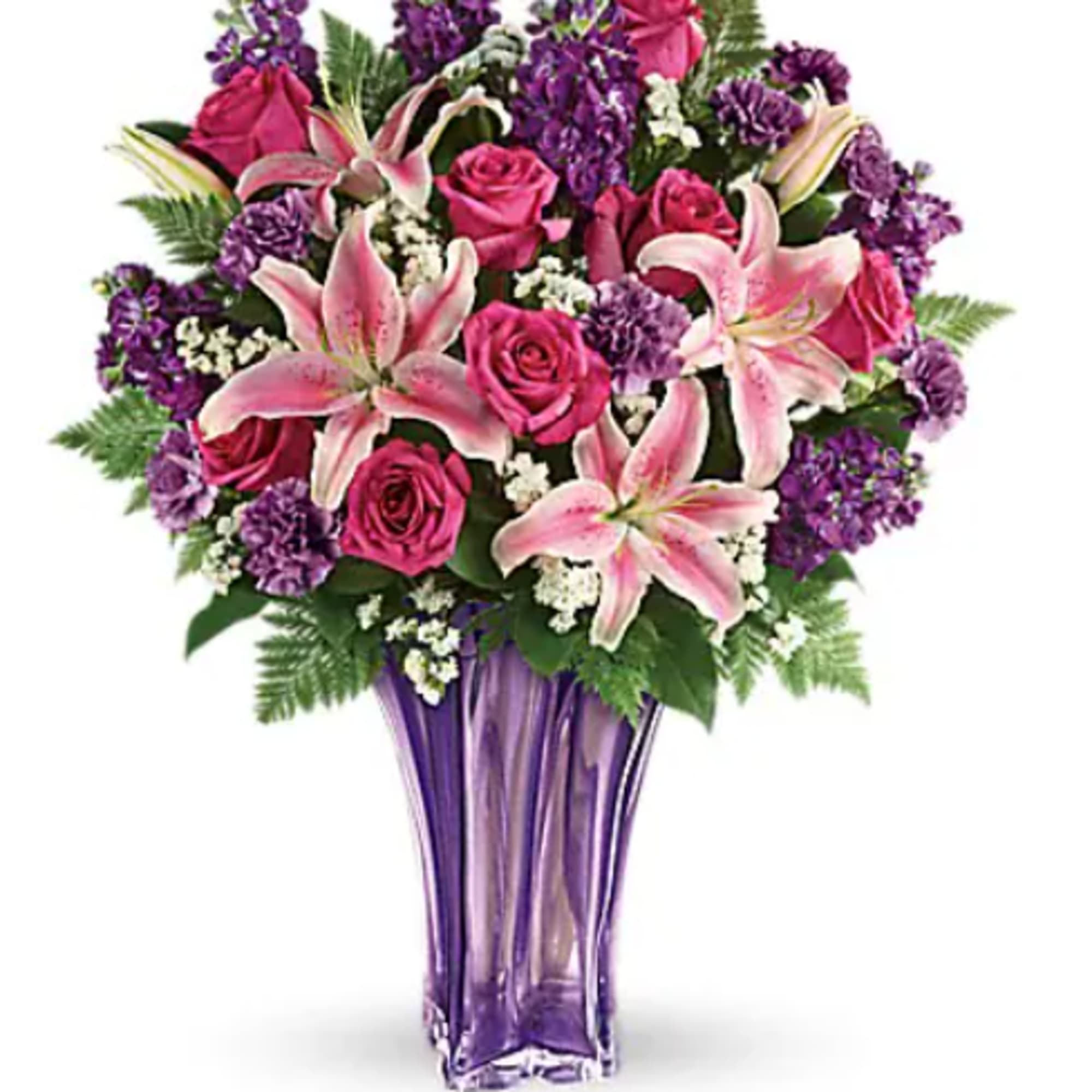 Pink roses and lilies in a purple glass vase
