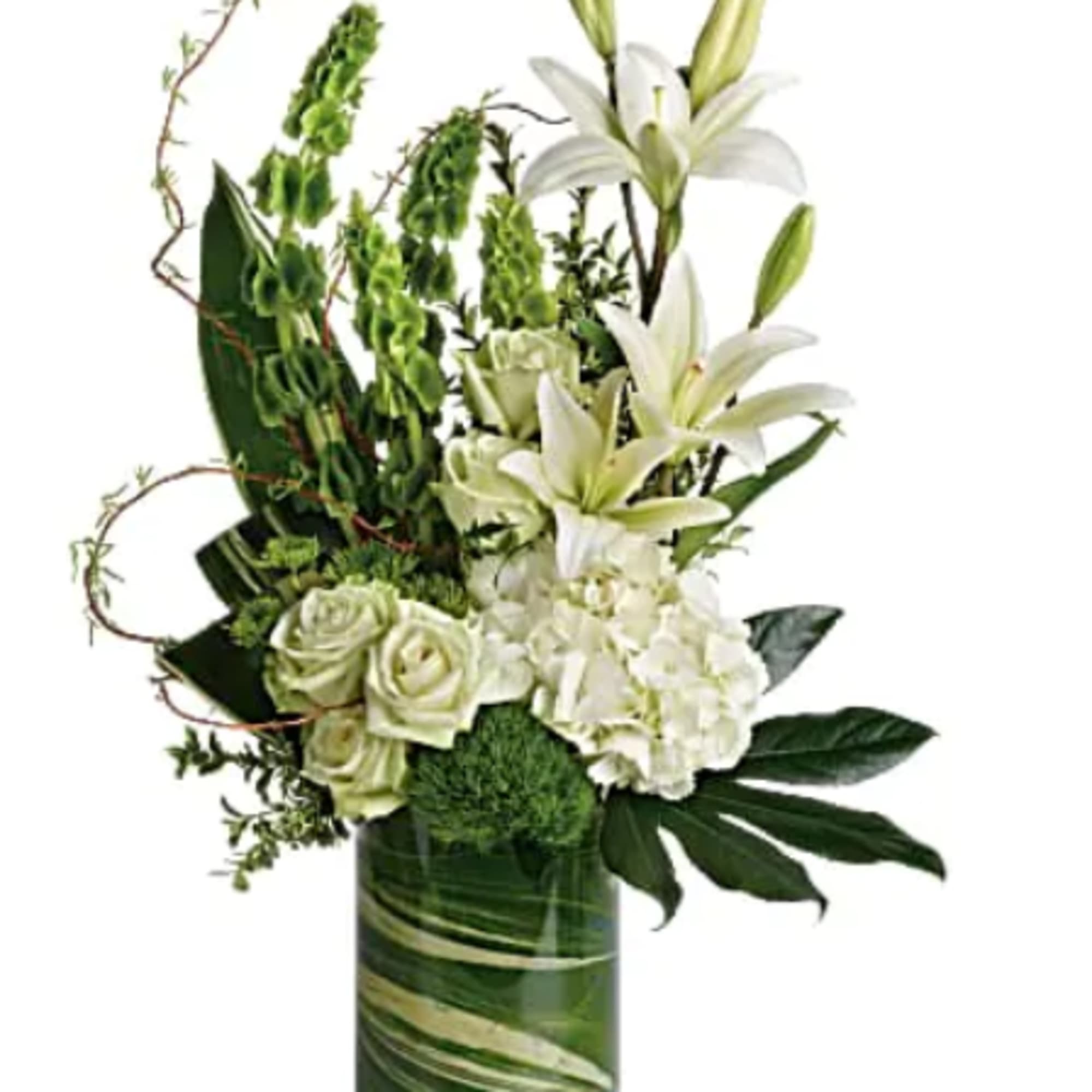White lilies and roses arranged in a tall glass vase