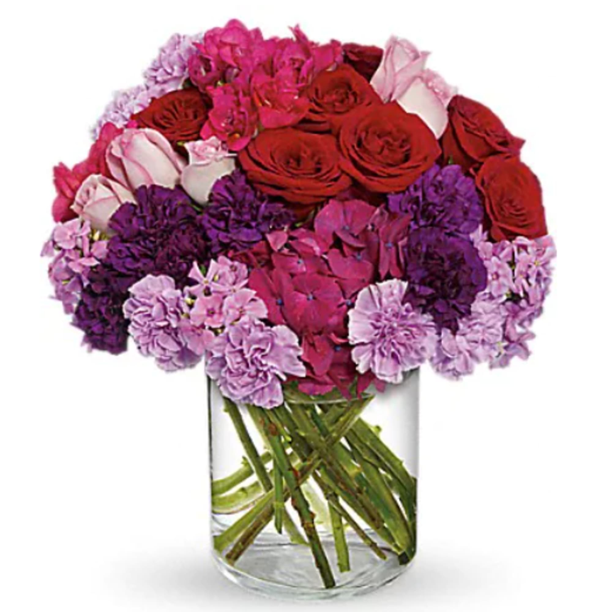 Bouquet of red, pink, and purple flowers in a clear glass vase