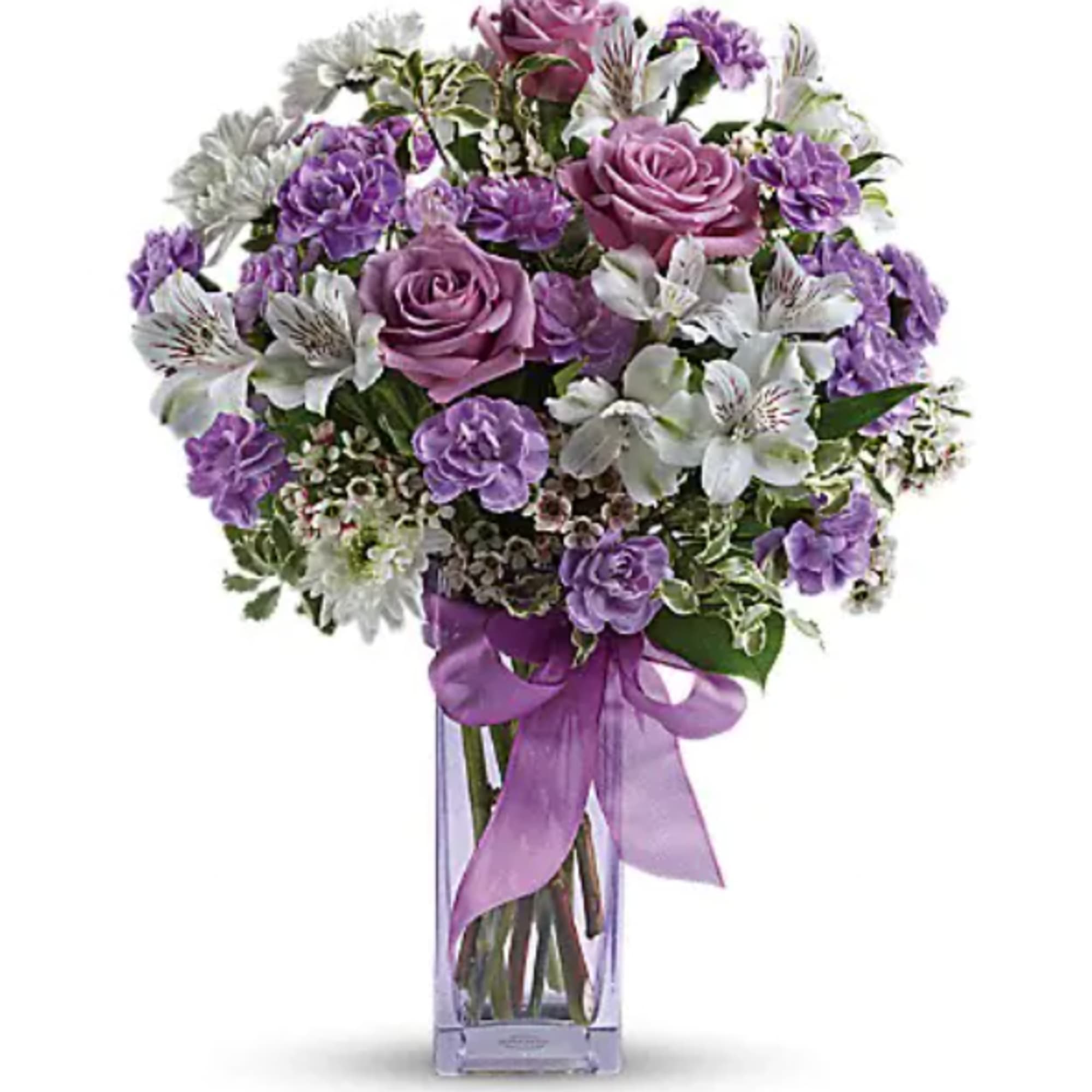 Purple and white bouquet in a clear glass vase with a ribbon